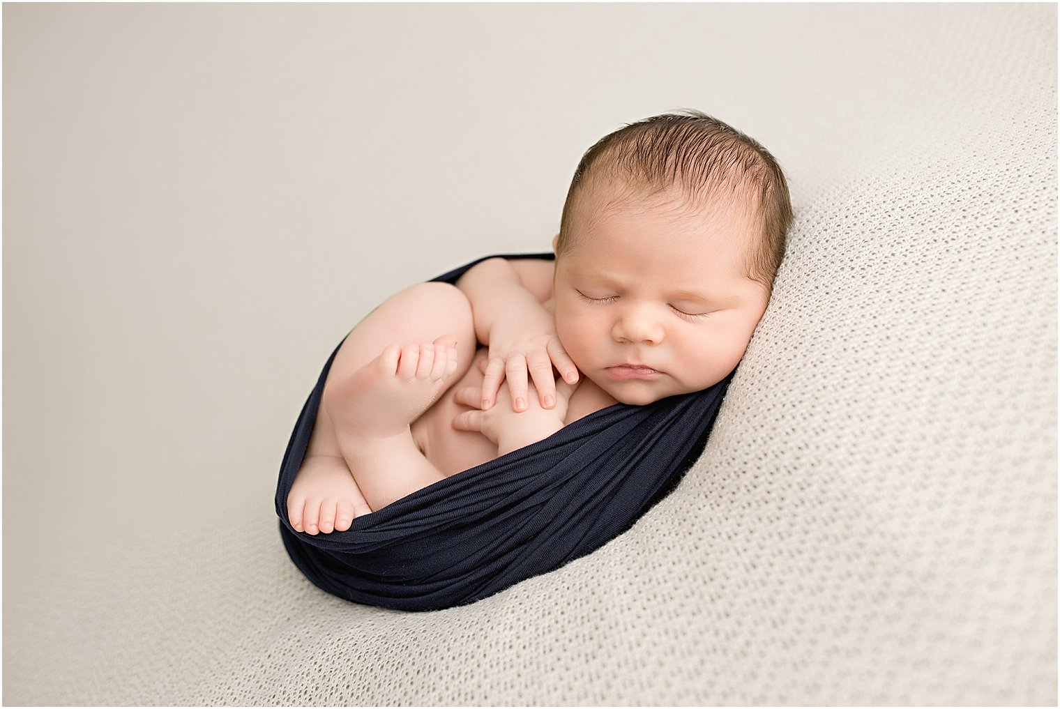 Curly newborn pose