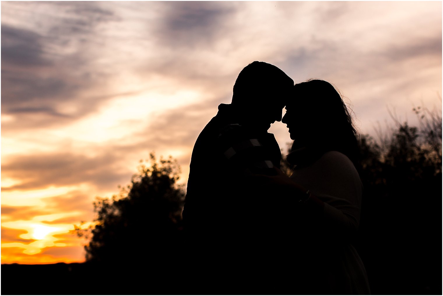 Sunset silhouette engagement photo