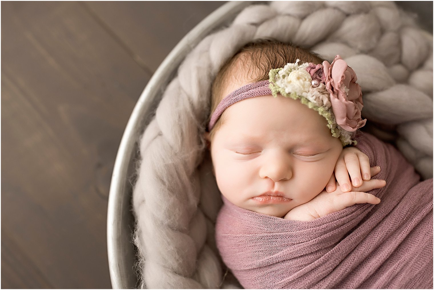 Baby girl in mauve wrap and headband