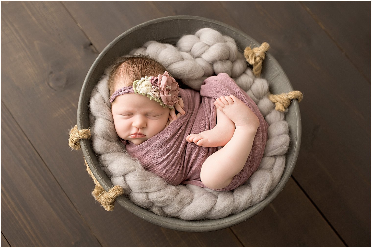 Baby in a metal bucket