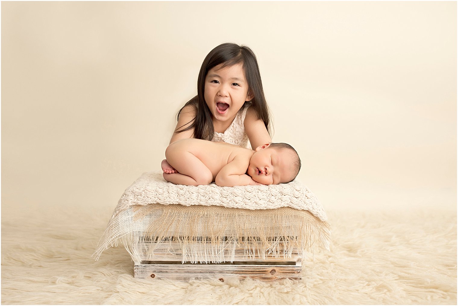 Portrait session of newborn boy and his older sister