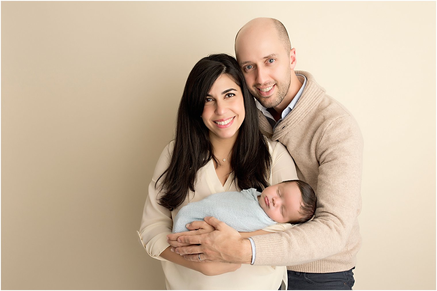 Newborn with his parents