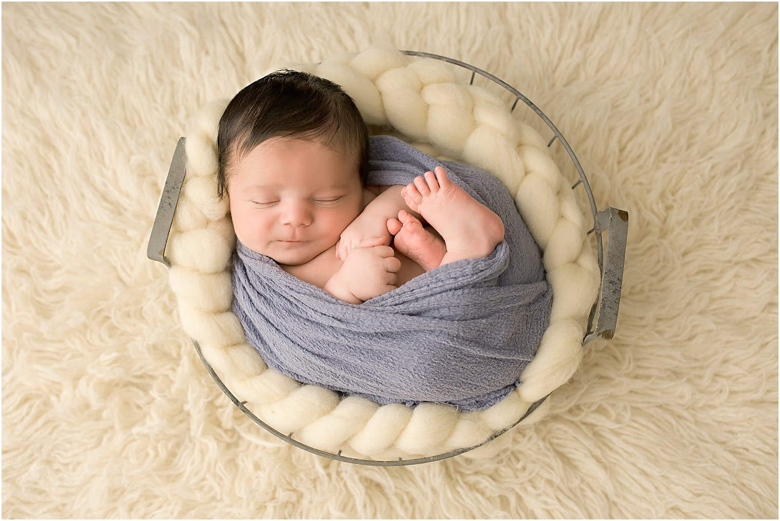 Baby boy in basket