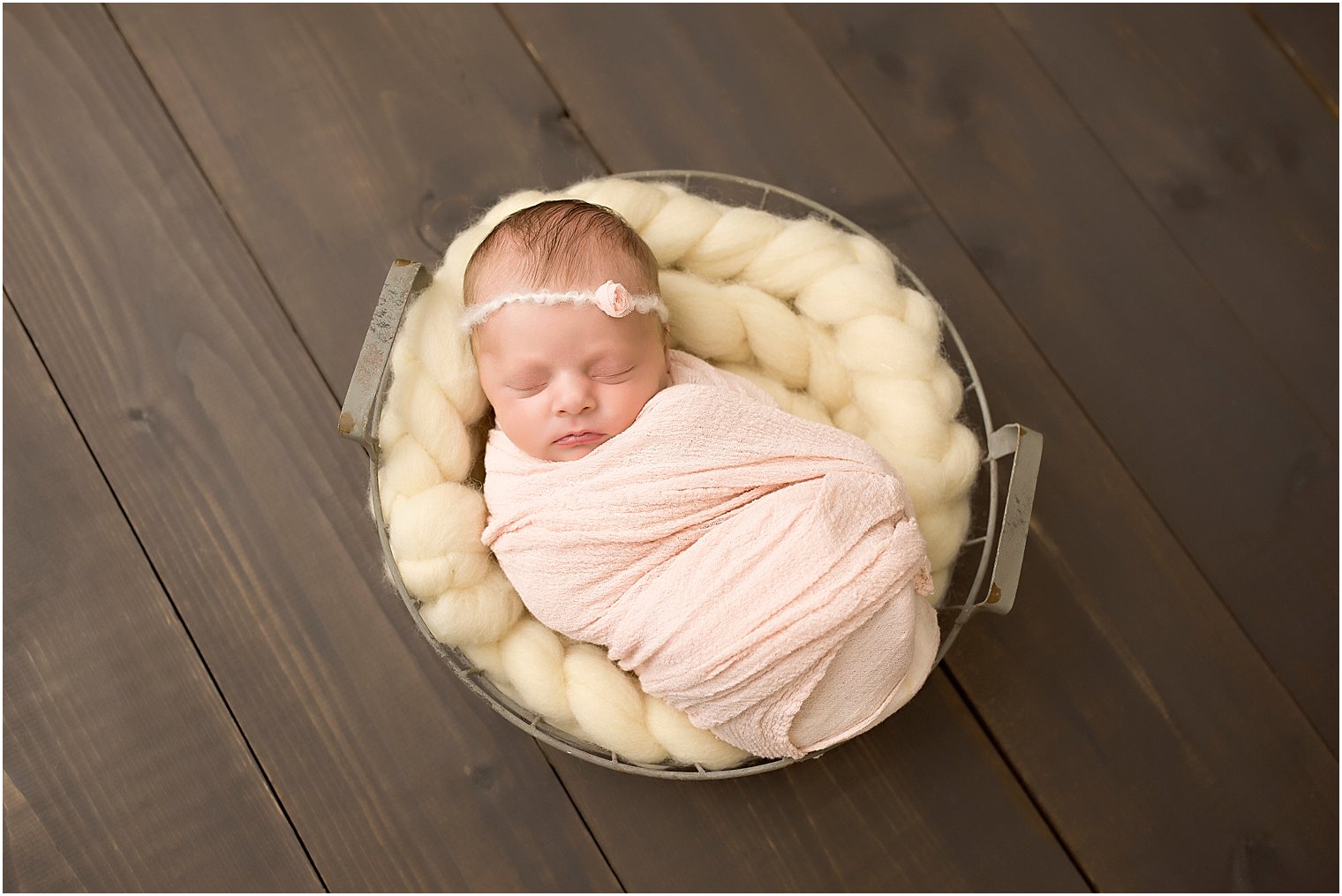 Baby in a wire basket