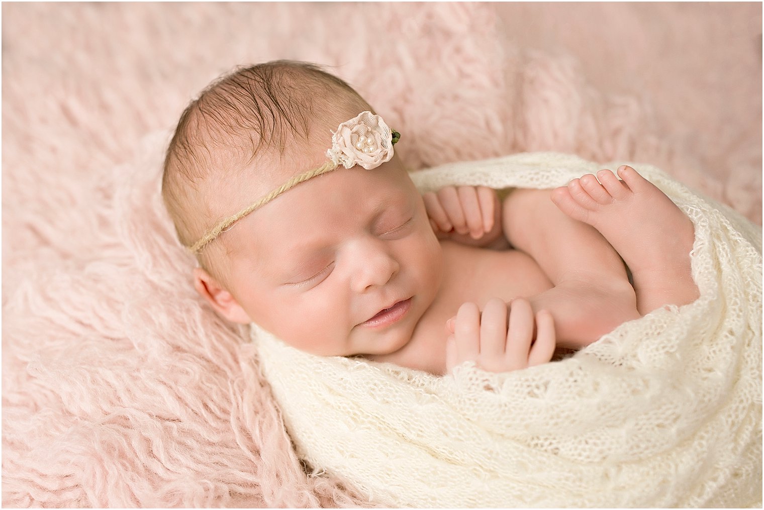 Smiling newborn girl