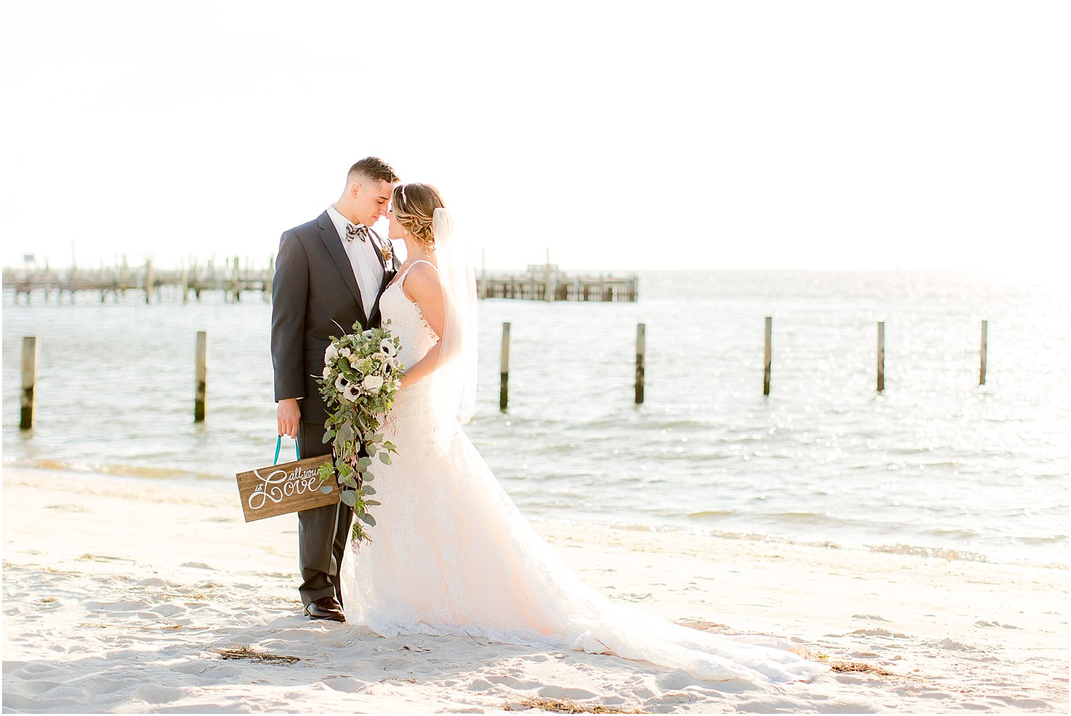 Couple's portrait at sunset of bride and groom at the Brant Beach Yacht Club Wedding