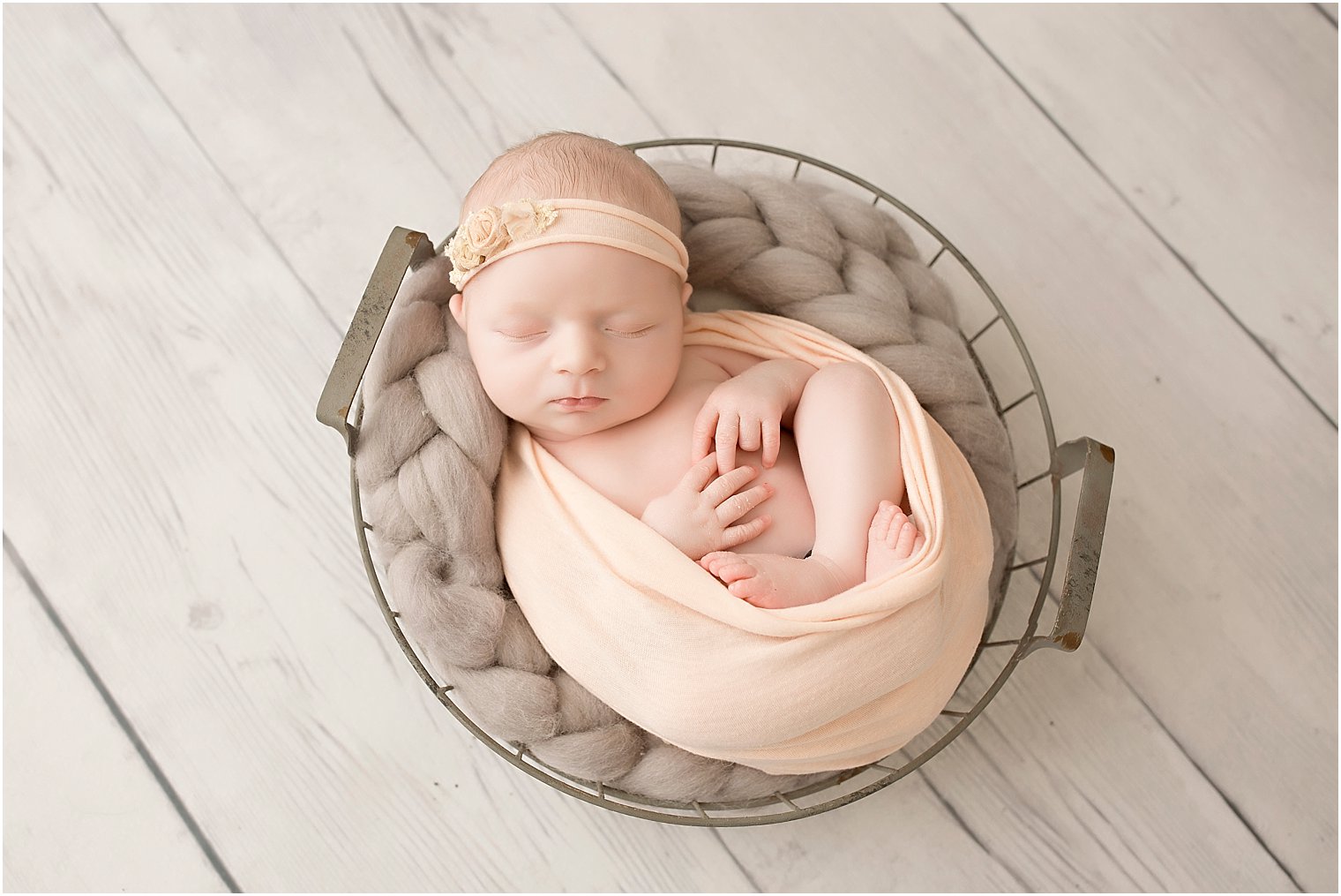 Sleeping newborn girl in studio session