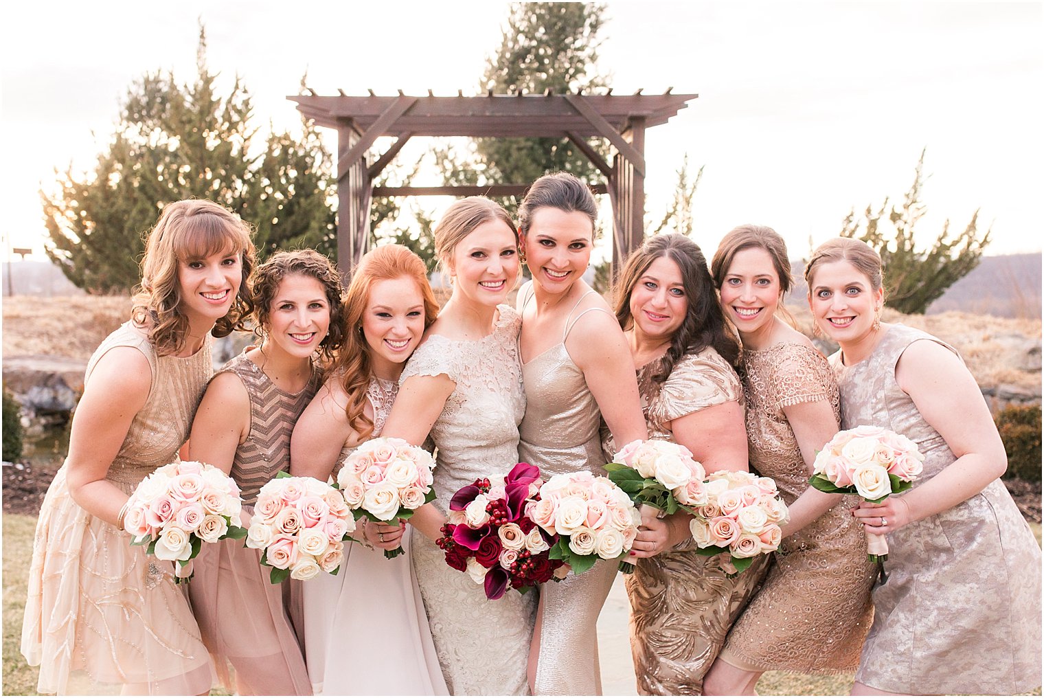 Bridesmaids in champagne dresses | Photo by Idalia Photography