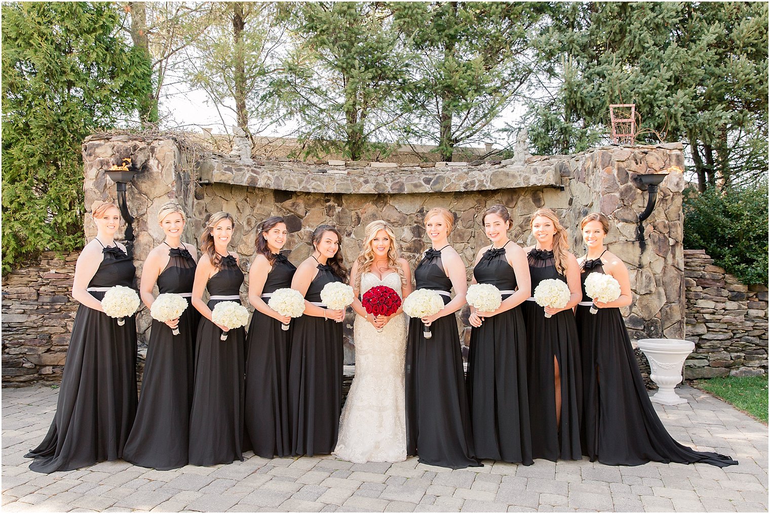 Elegant wedding with bridesmaids in black | Photo by Idalia Photography