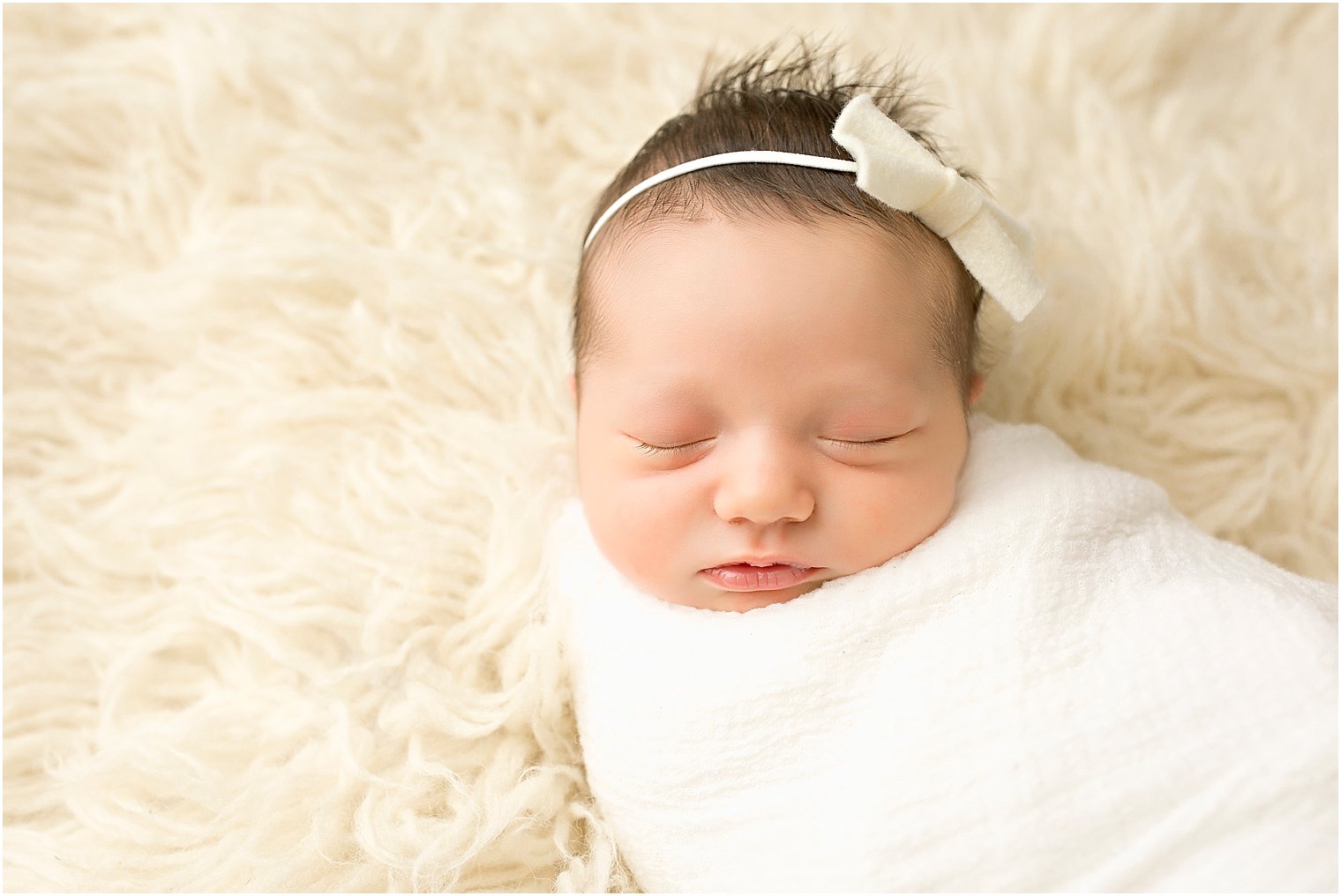 Swaddled newborn girl | Photos by Idalia Photography