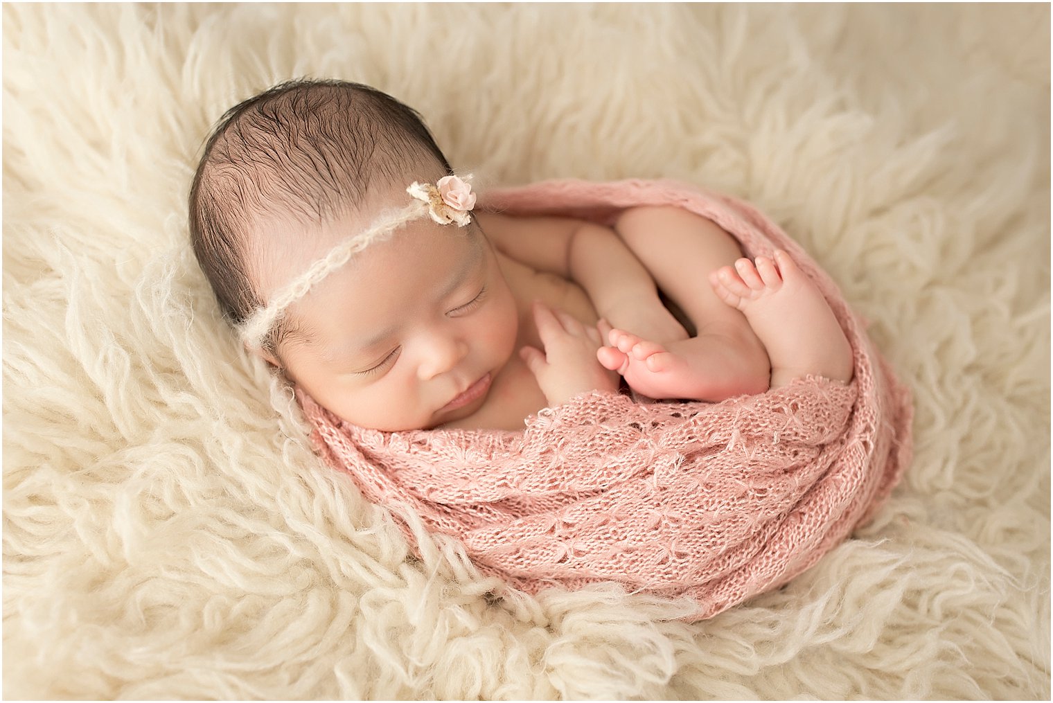 Newborn girl in Huck Finn pose