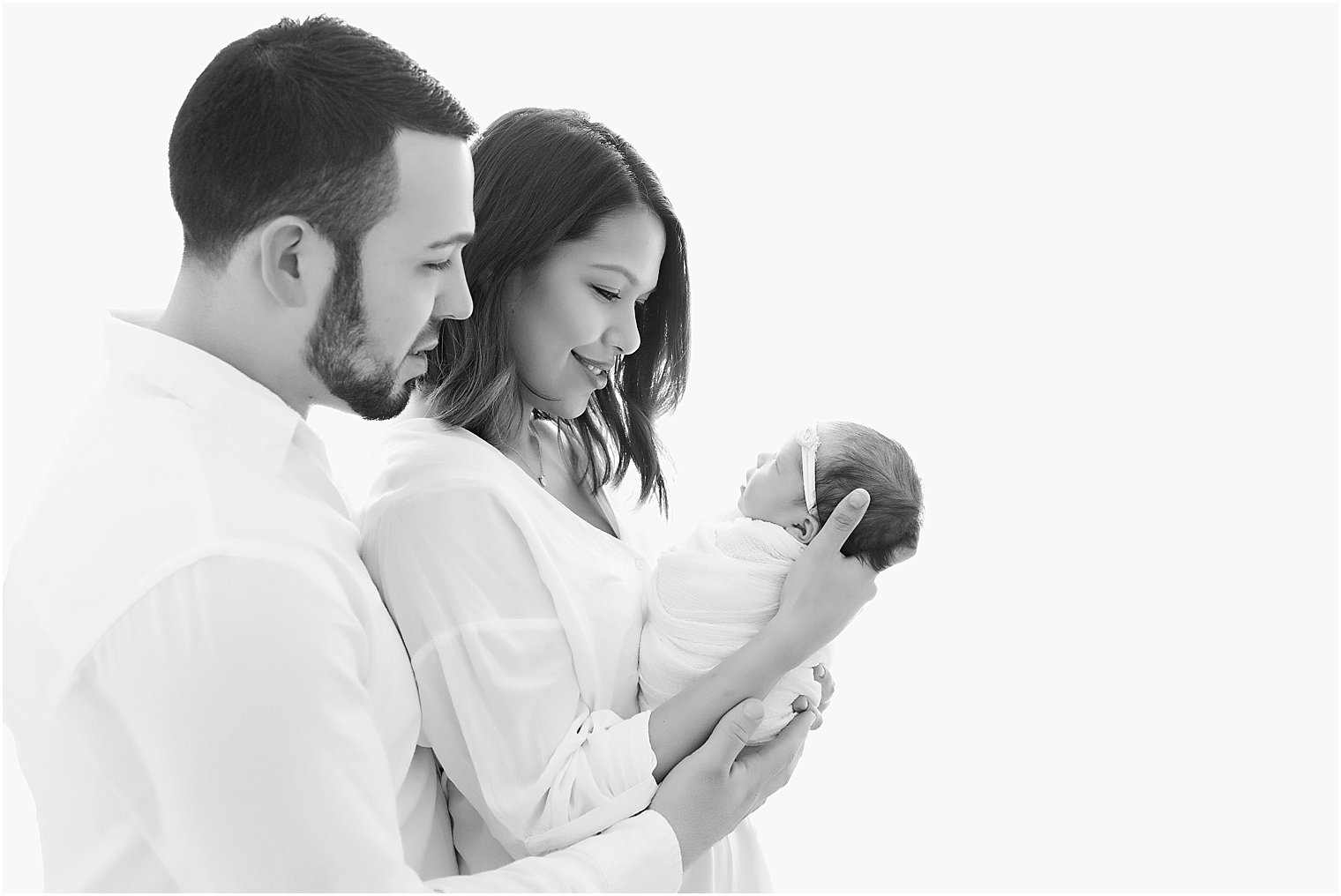 Backlit newborn and family photo