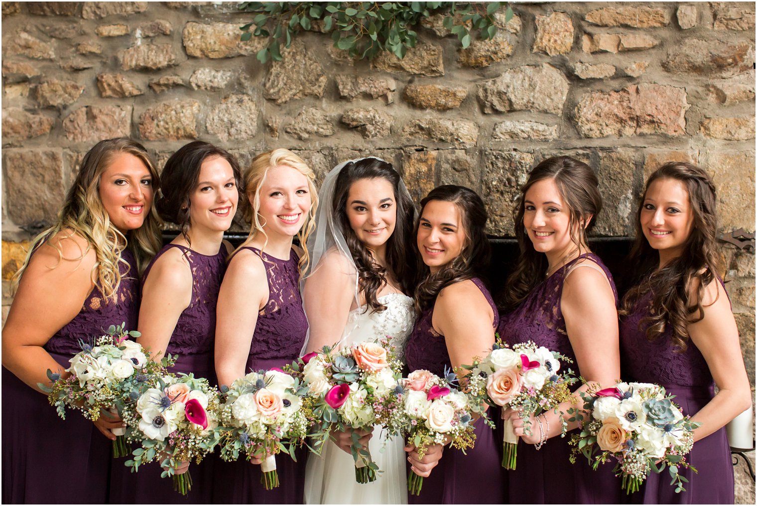 Bride and bridesmaids in purple dresses