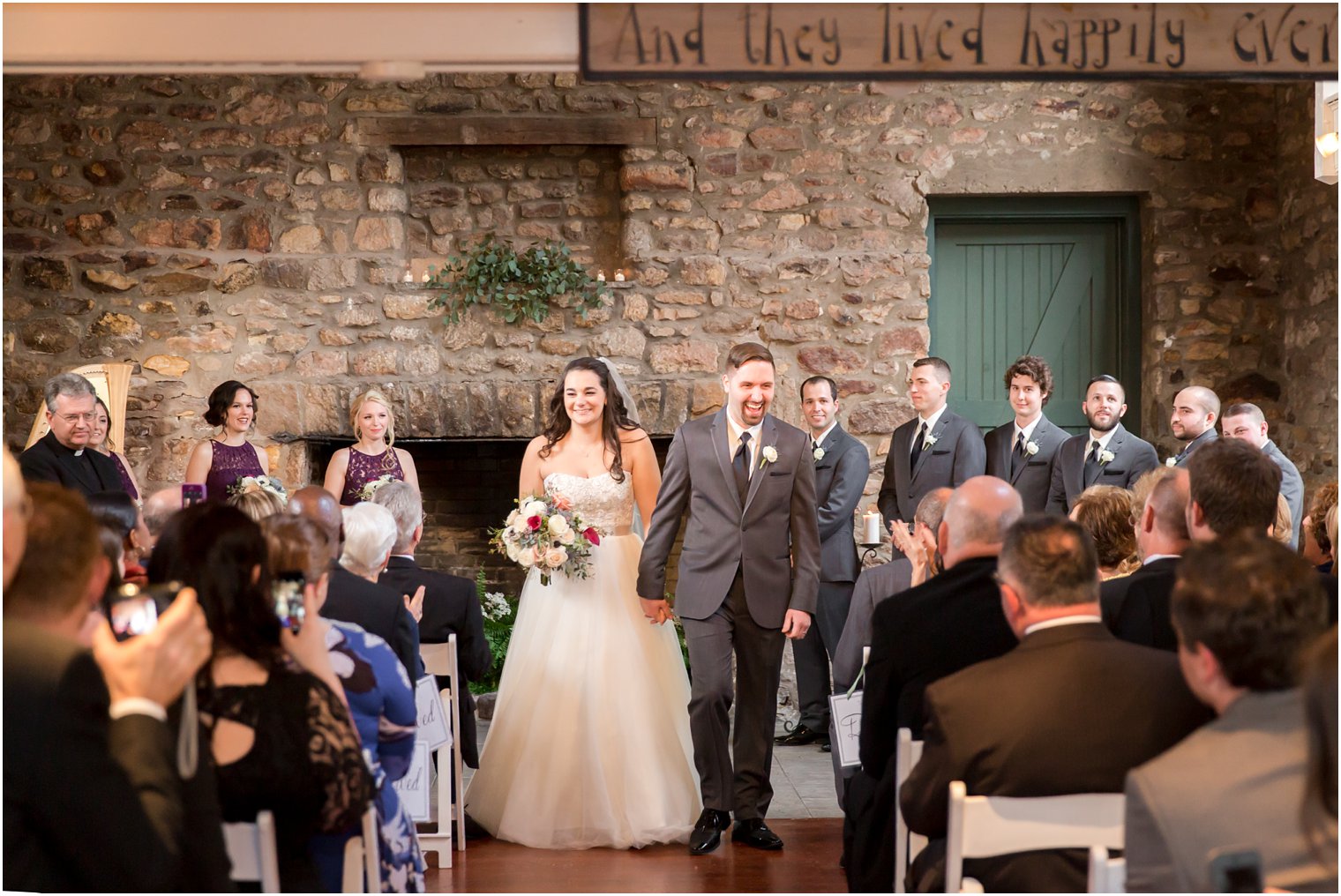 Recessional photo of bride and groom at Holly Hedge Estate | Photo by Idalia Photography