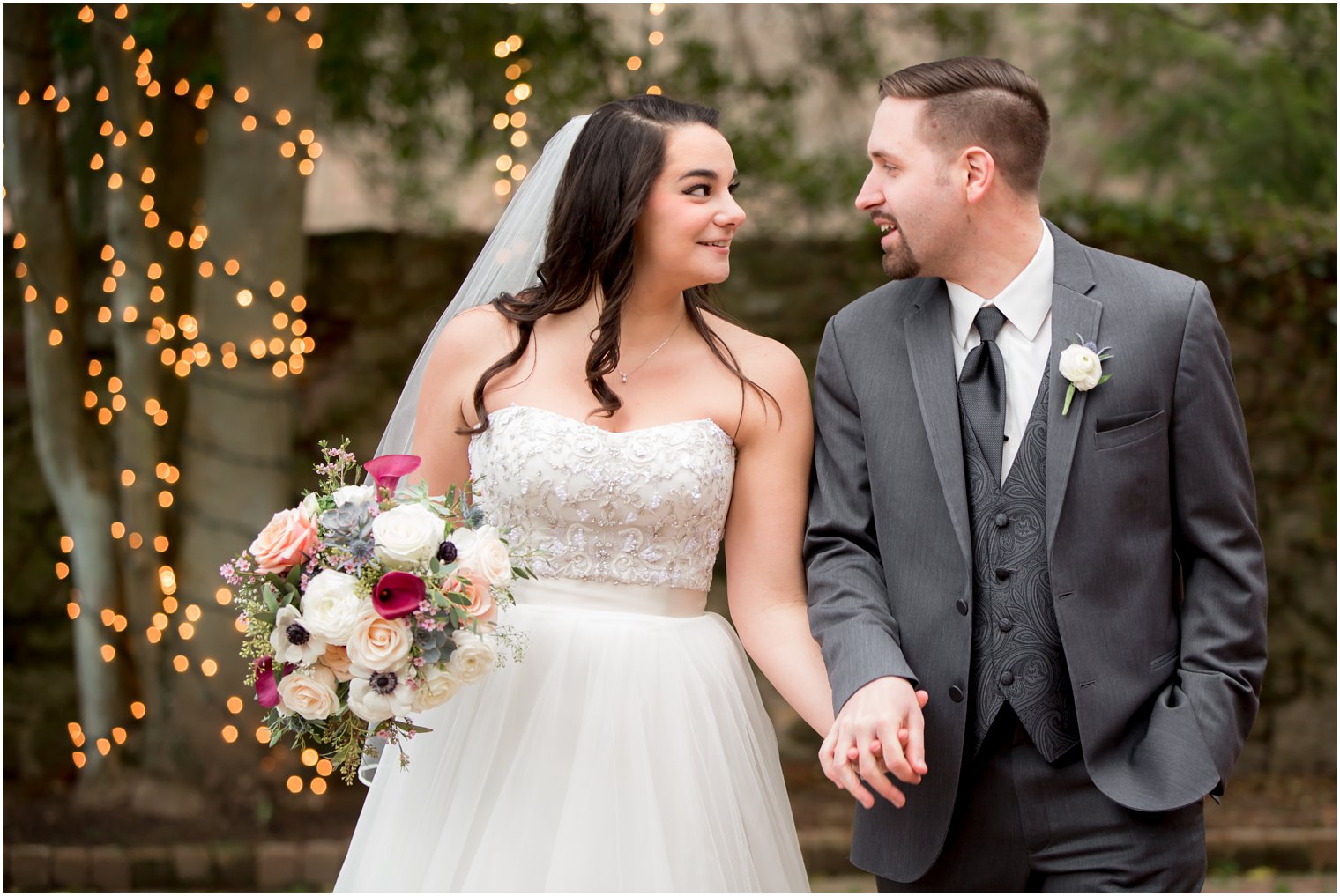 Bride and groom walking holding hands | Photo by PA Wedding Photographers Idalia Photography