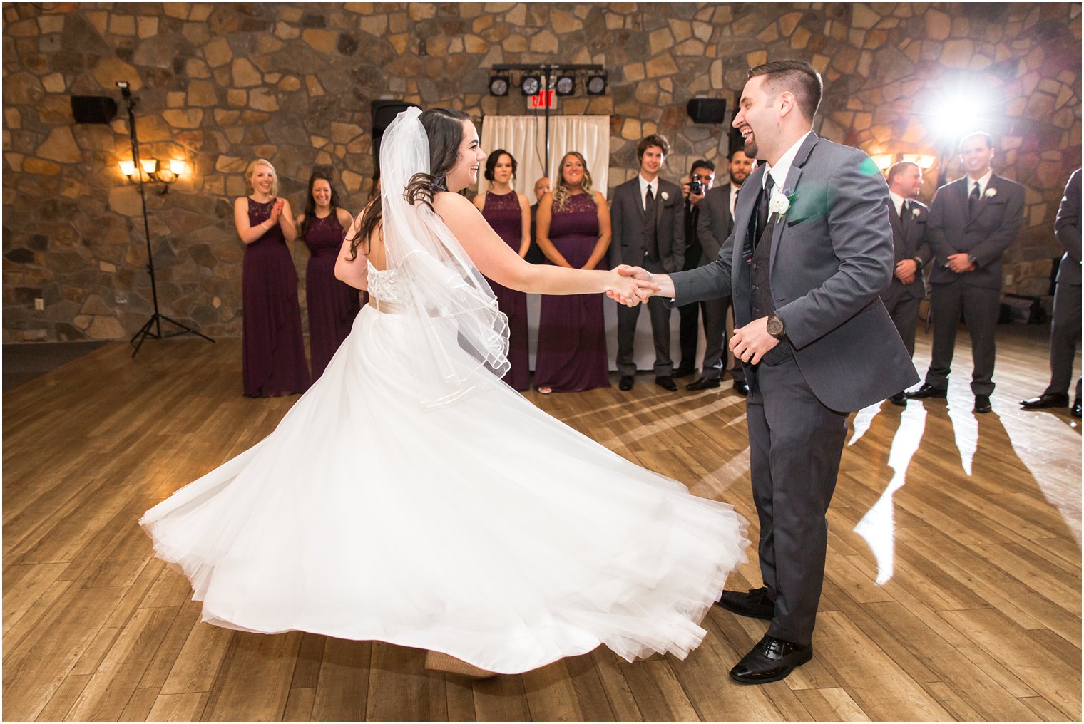 Groom twirling his bride on the dance floor | Photo by PA Wedding Photographers Idalia Photography
