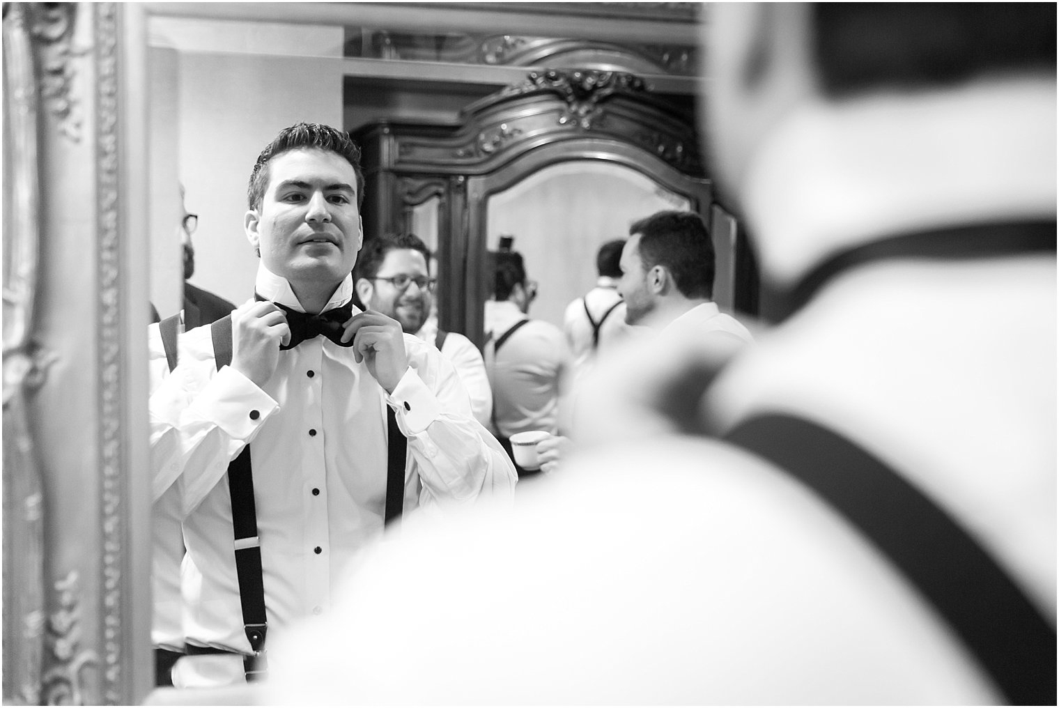 Black and white photo of groom on his wedding day | Photo by Idalia Photography