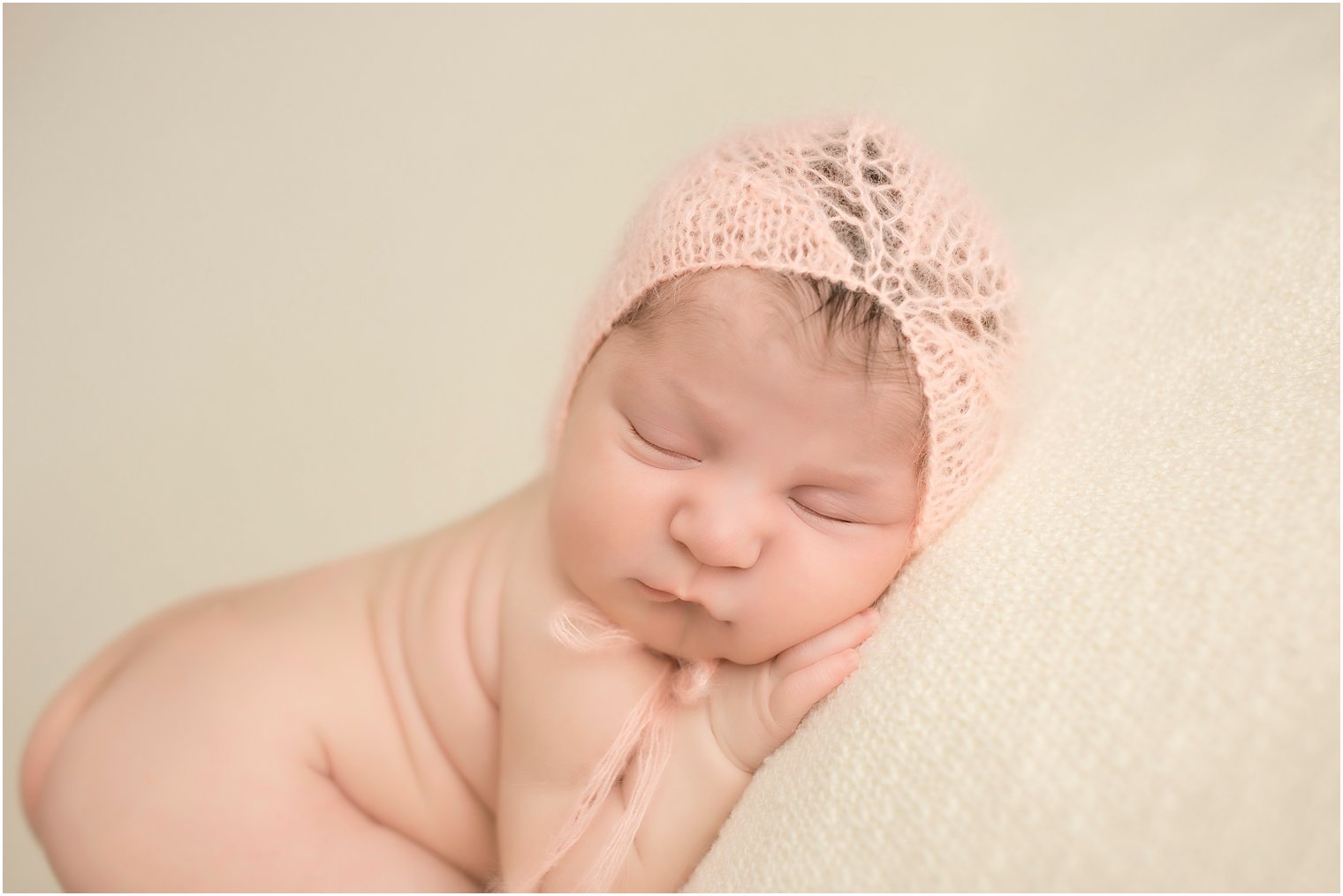 Newborn girl wearing mohair hat by Blueberry Props