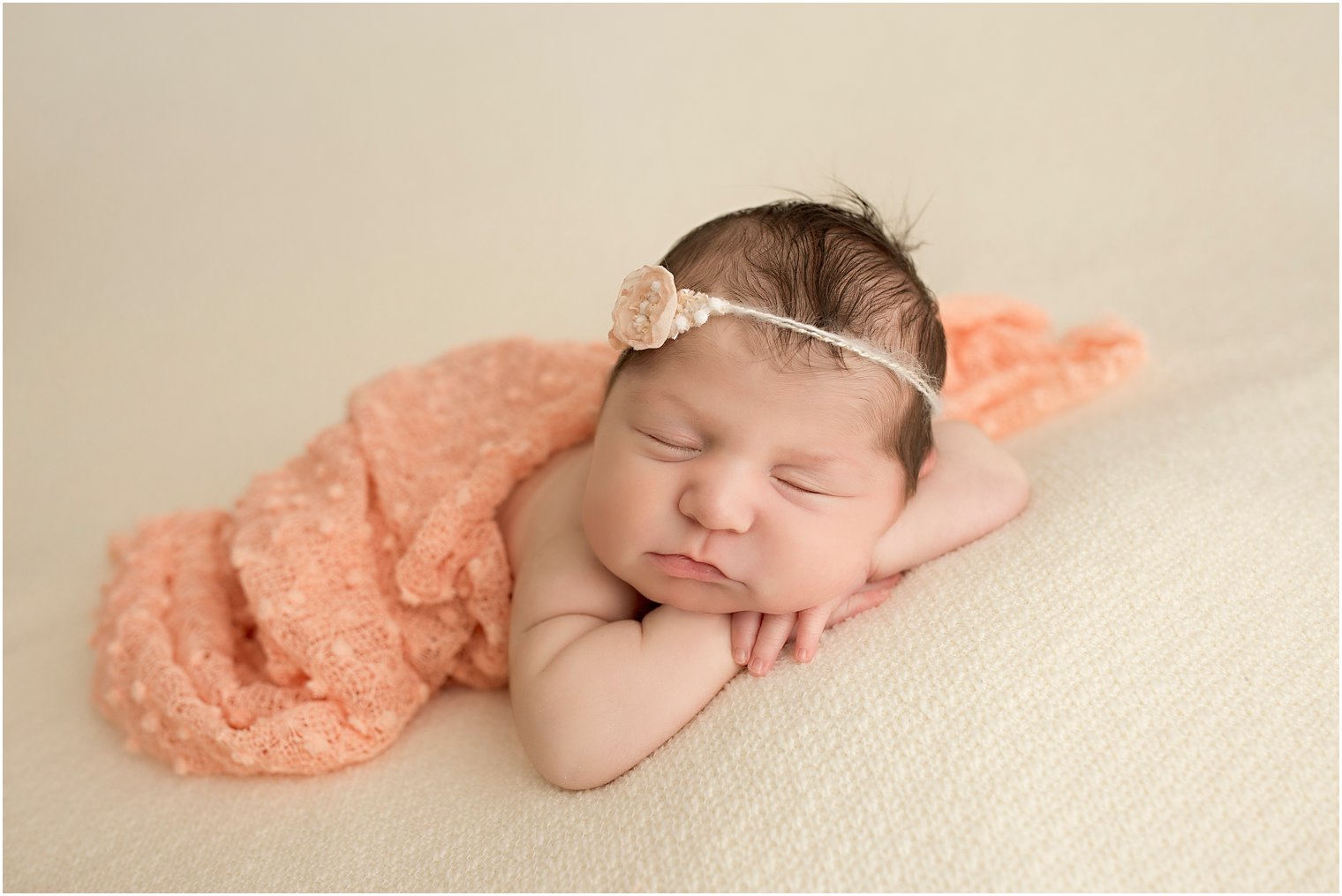 Sleepy newborn girl