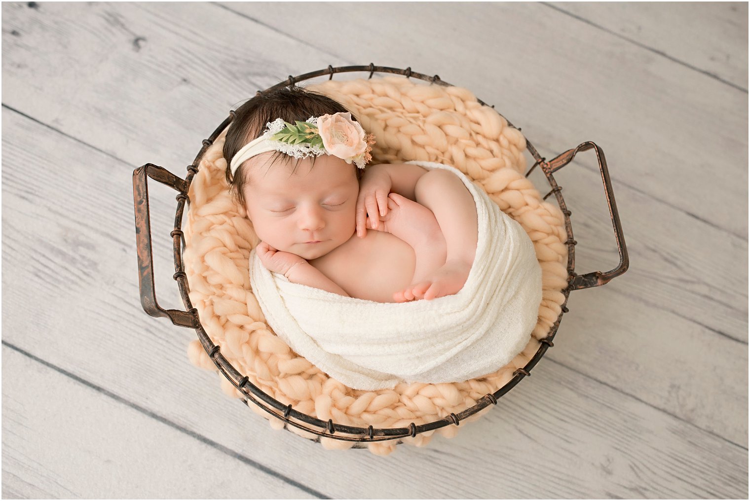 Newborn girl in wire basket | Photos by Idalia Photography