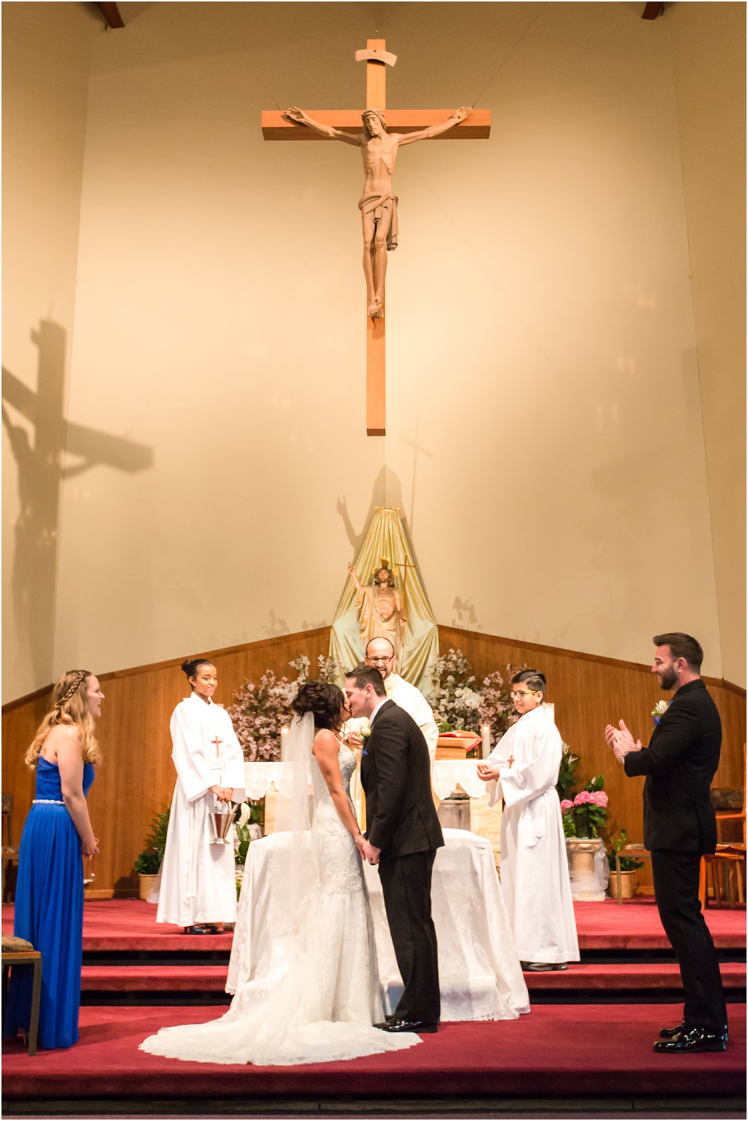 First kiss during wedding ceremony at St. Helena's Roman Catholic Church