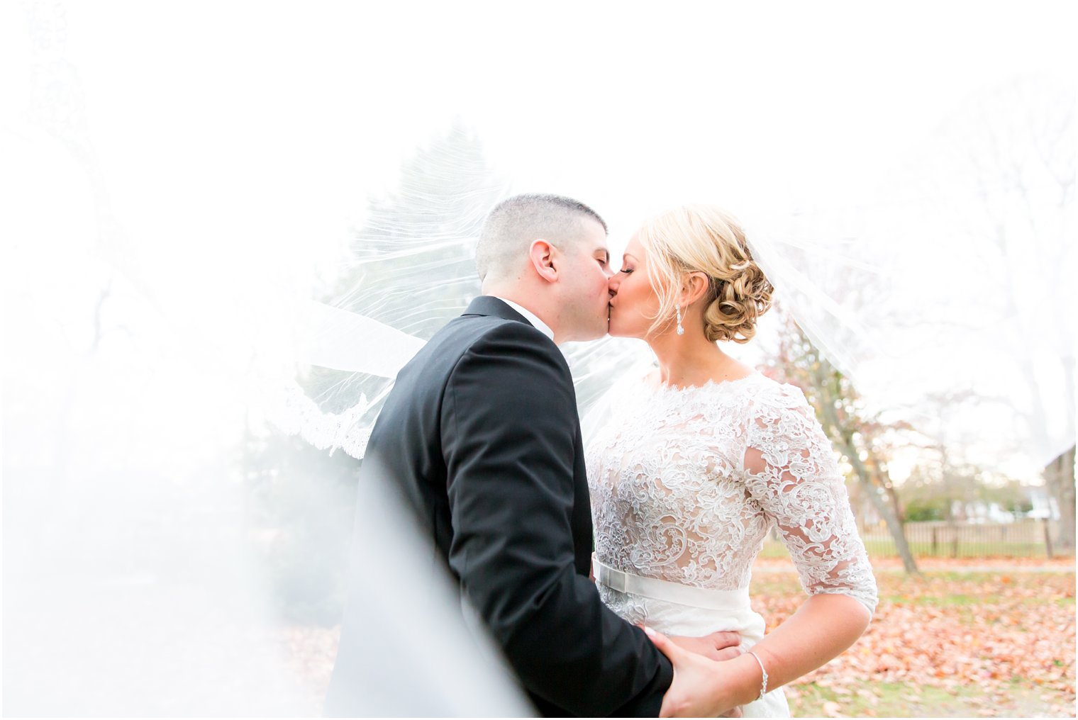 Romantic bride and groom photo under the veil | Photo by Idalia Photography