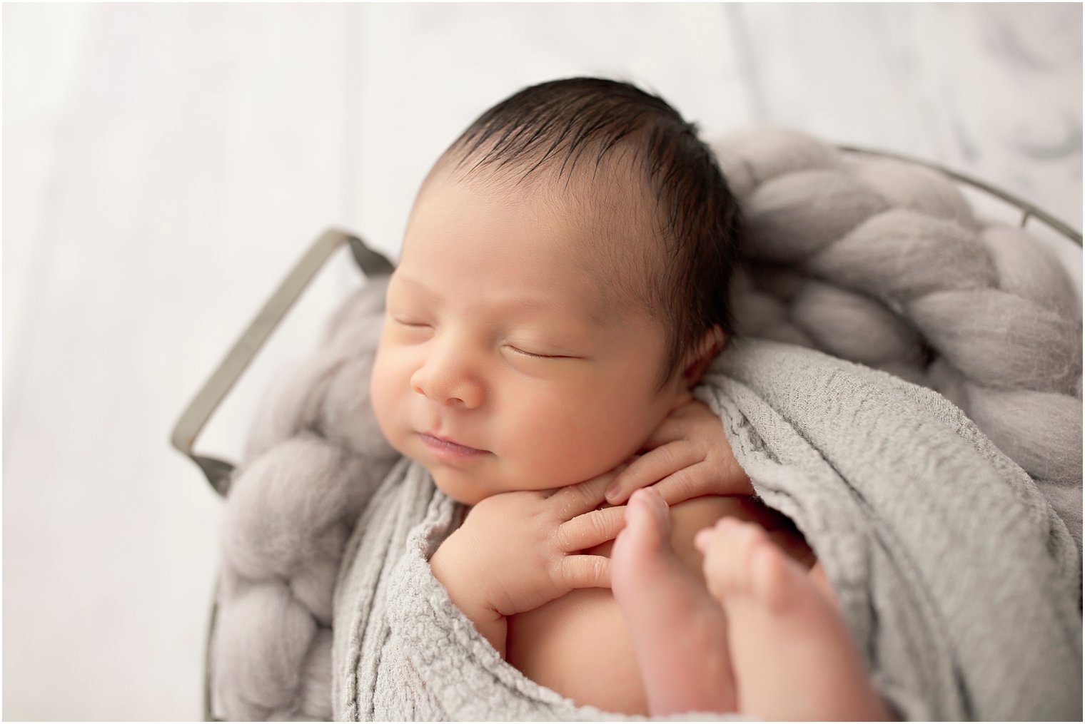 Sleeping boy in basket