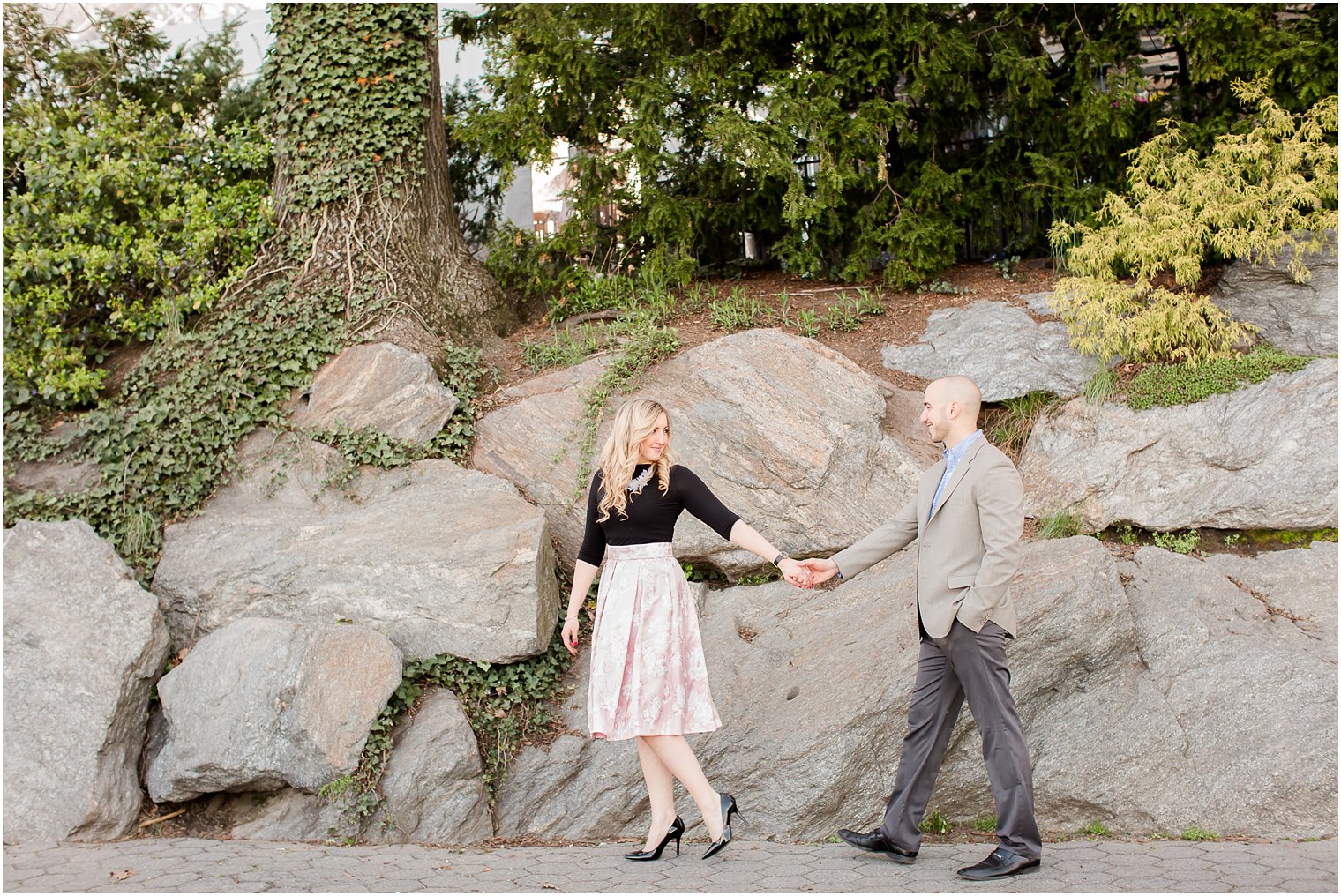 Engaged couple walking in the park