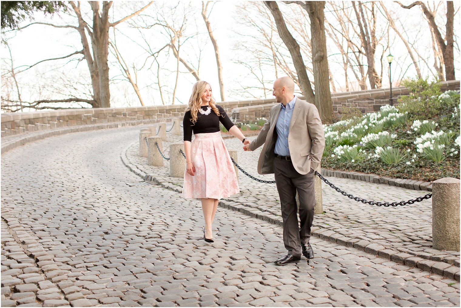 Couple walking at Cloisters in NYC
