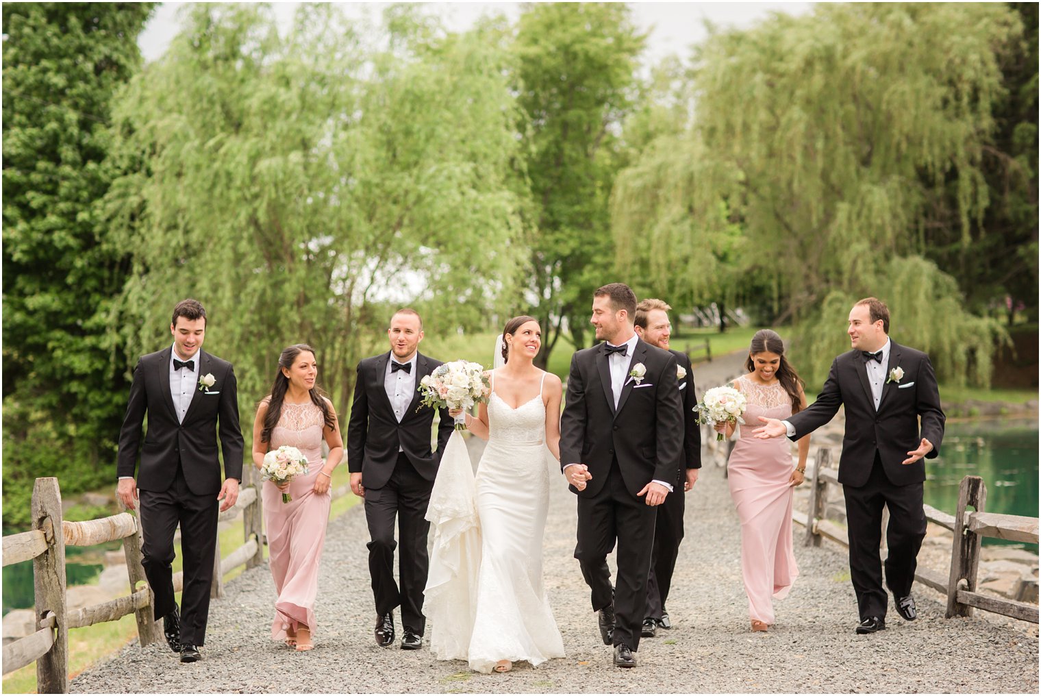 Bridal party walking on Windows on the Water grounds | Photos by Idalia Photography