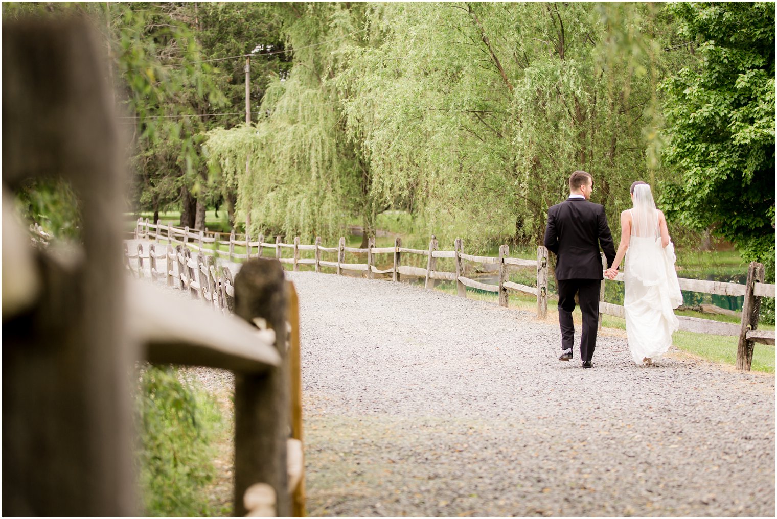 Bride and groom walking | Photo by Idalia Photography