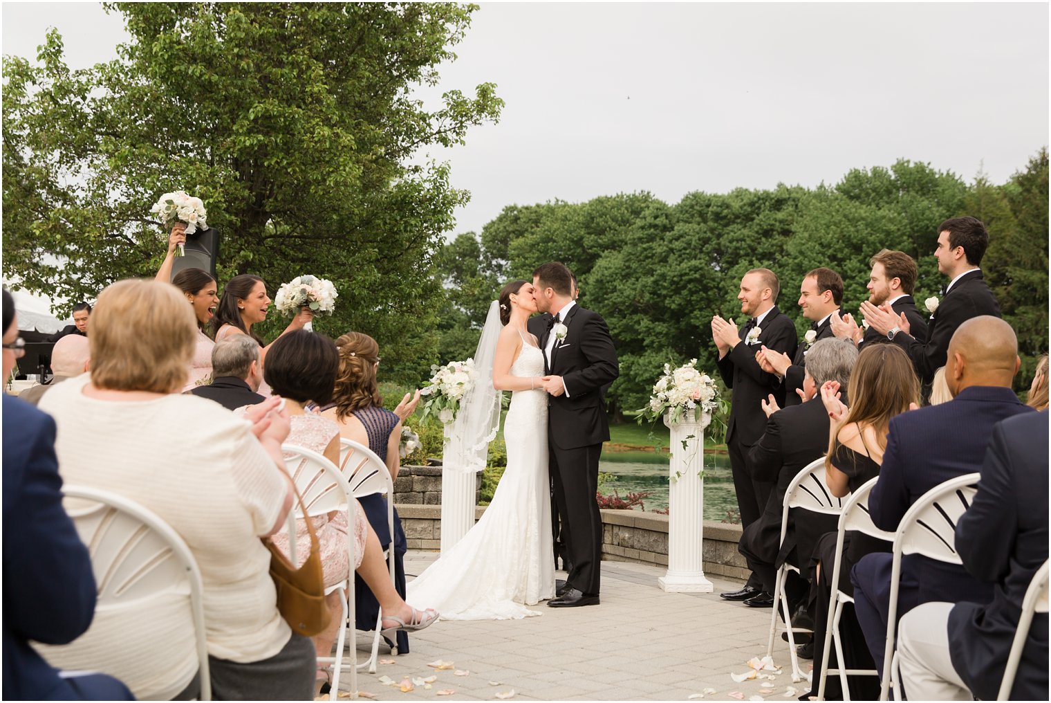 First kiss photo at Windows on the Water at Frogbridge | Photos by Idalia Photography
