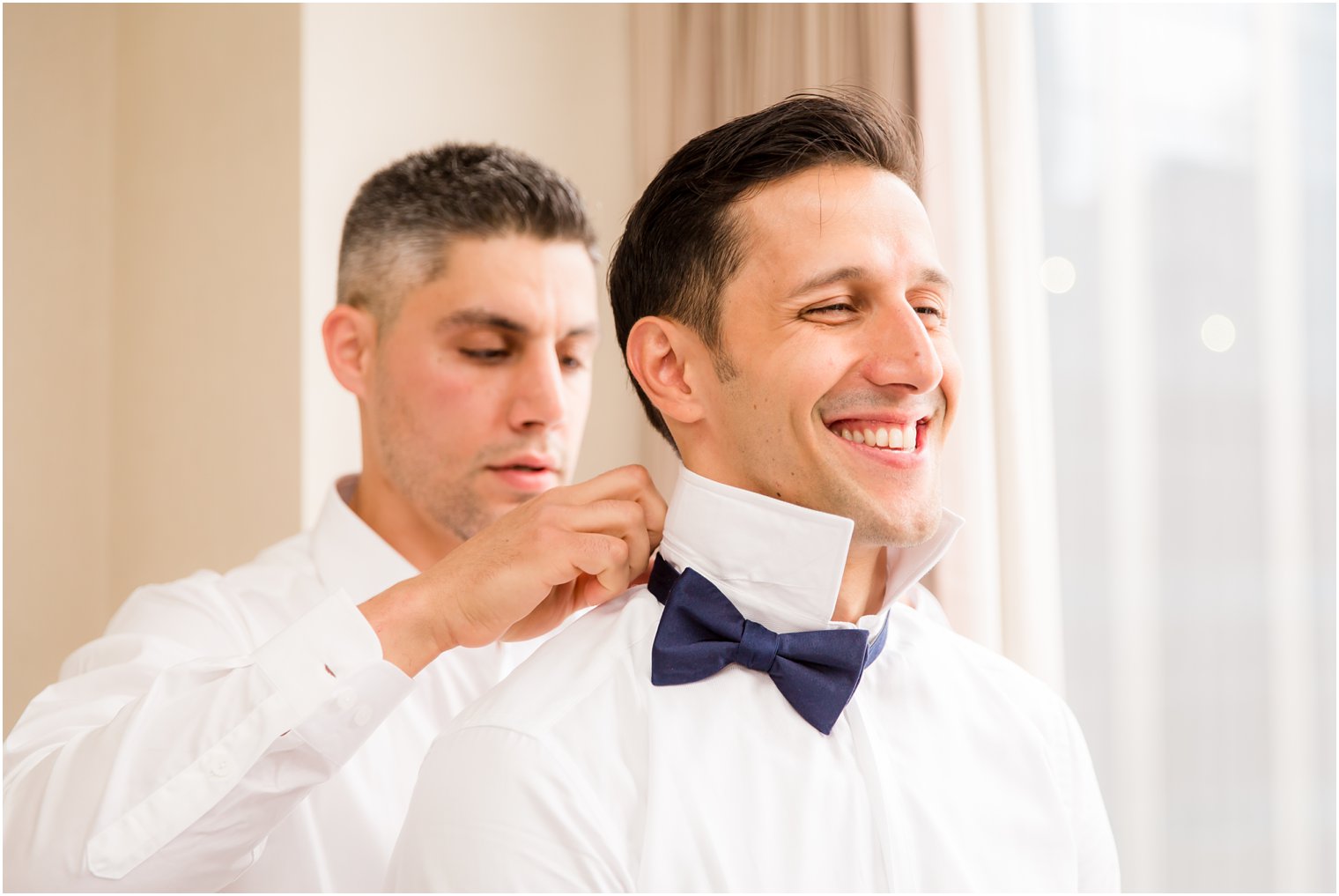 Groom getting ready with best man | Photo by Idalia Photography