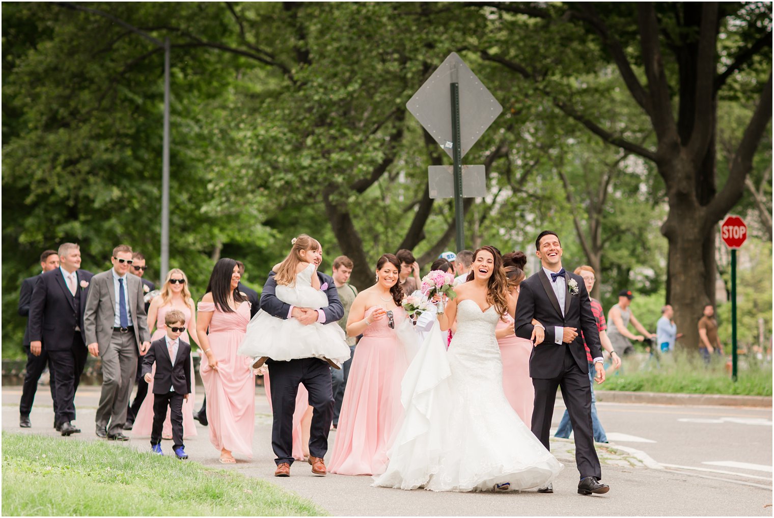 Bride and groom entering Central Park | Photo by Idalia Photography
