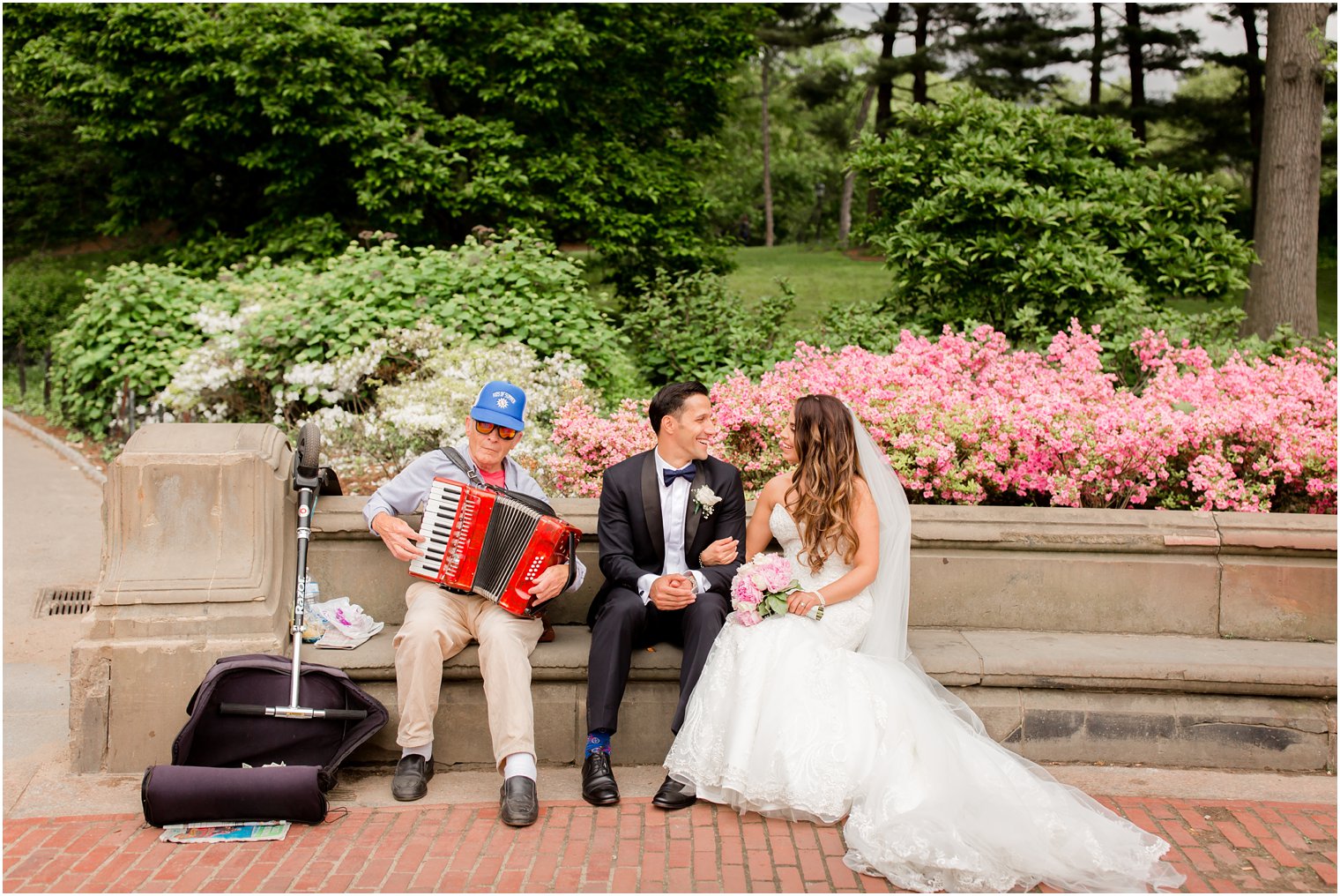 Bride and groom with musician in Central Park | Photo by Idalia Photography