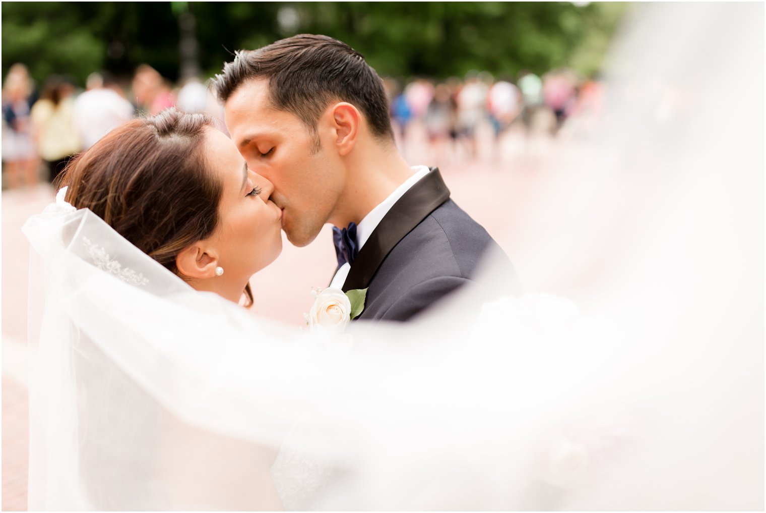 Romantic photo of bride and groom under veil | Photo by Idalia Photography
