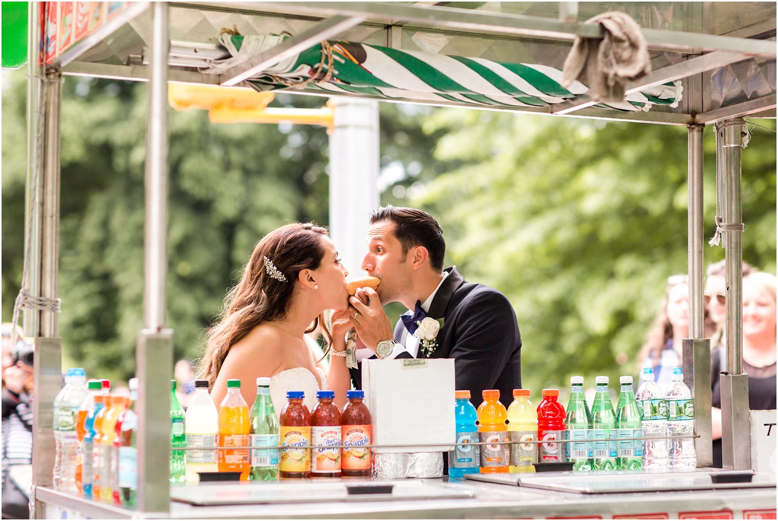 Bride and groom at hot dog stand | Photo by Idalia Photography
