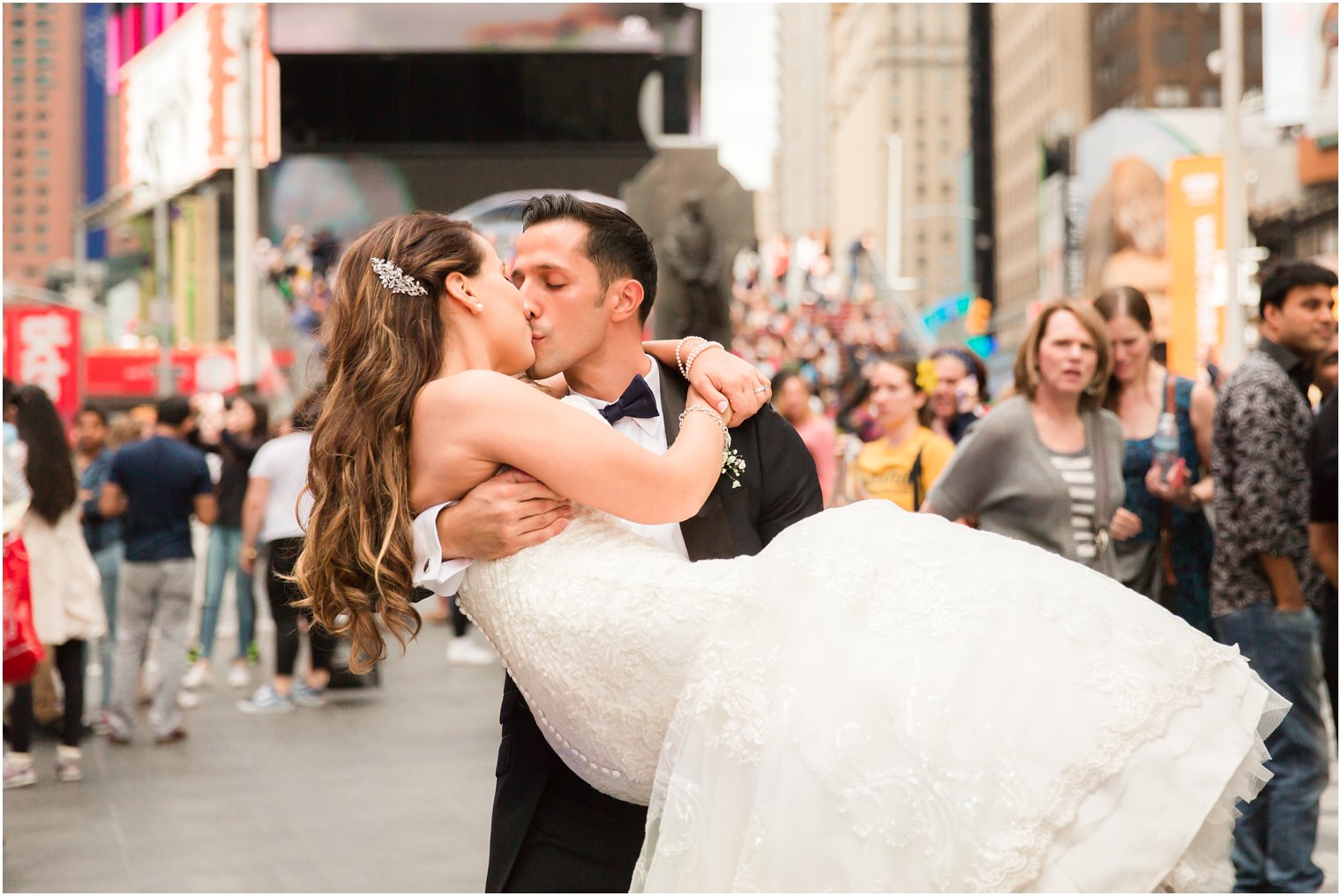 Bride and groom in Times Square | Photos by Idalia Photography