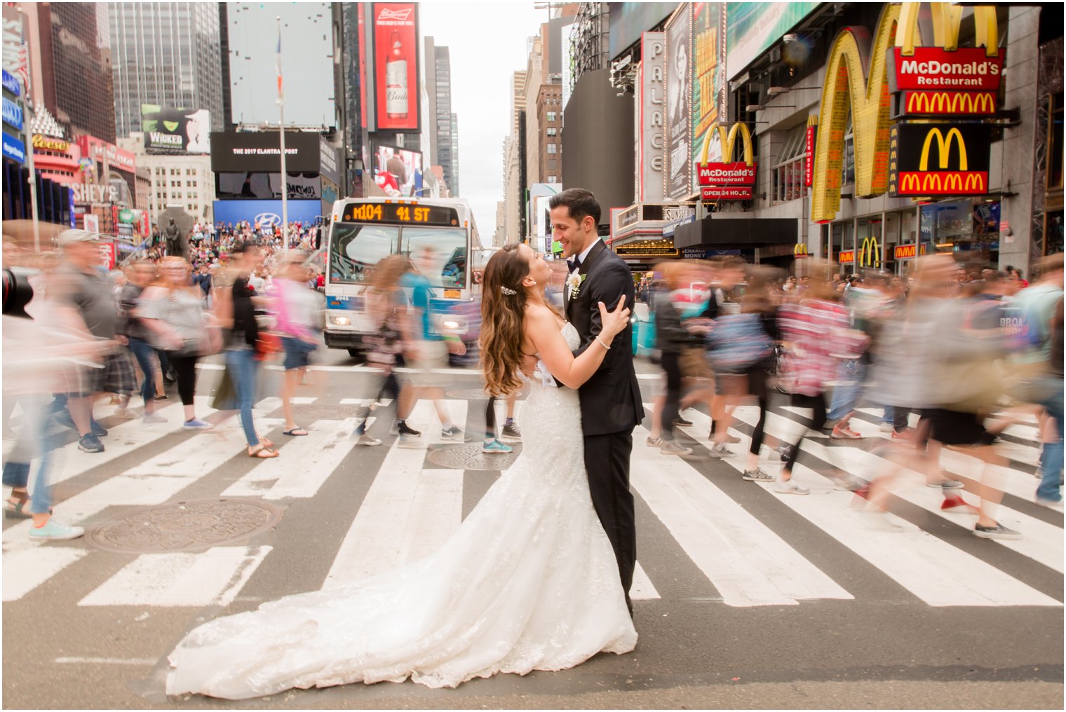 Slow shutter photo of bride and groom in Times Square | Photos by Idalia Photography