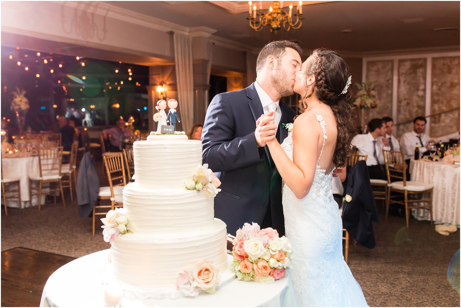 Bride and groom cutting wedding cake