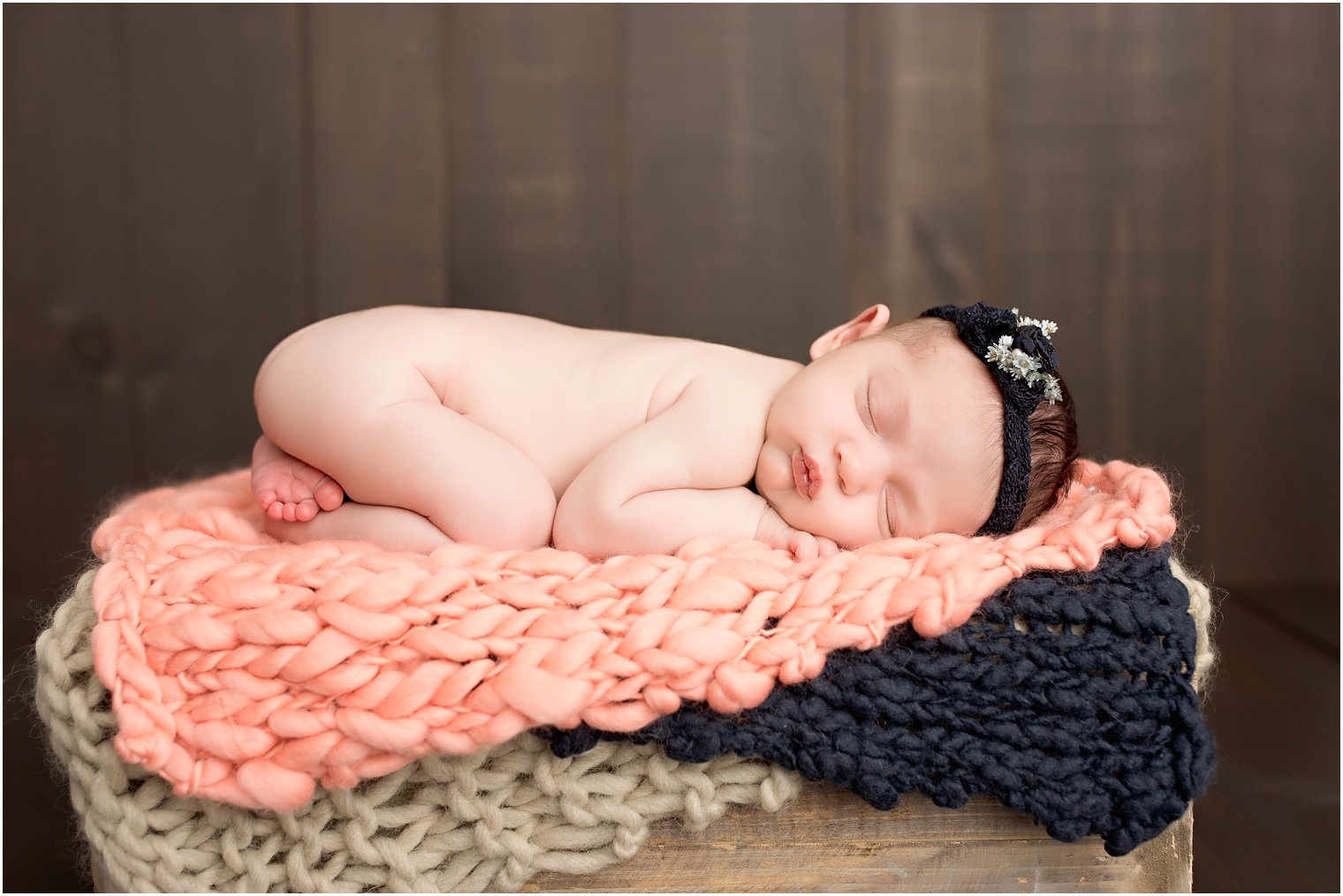 Newborn girl on crate photo by Idalia Photography