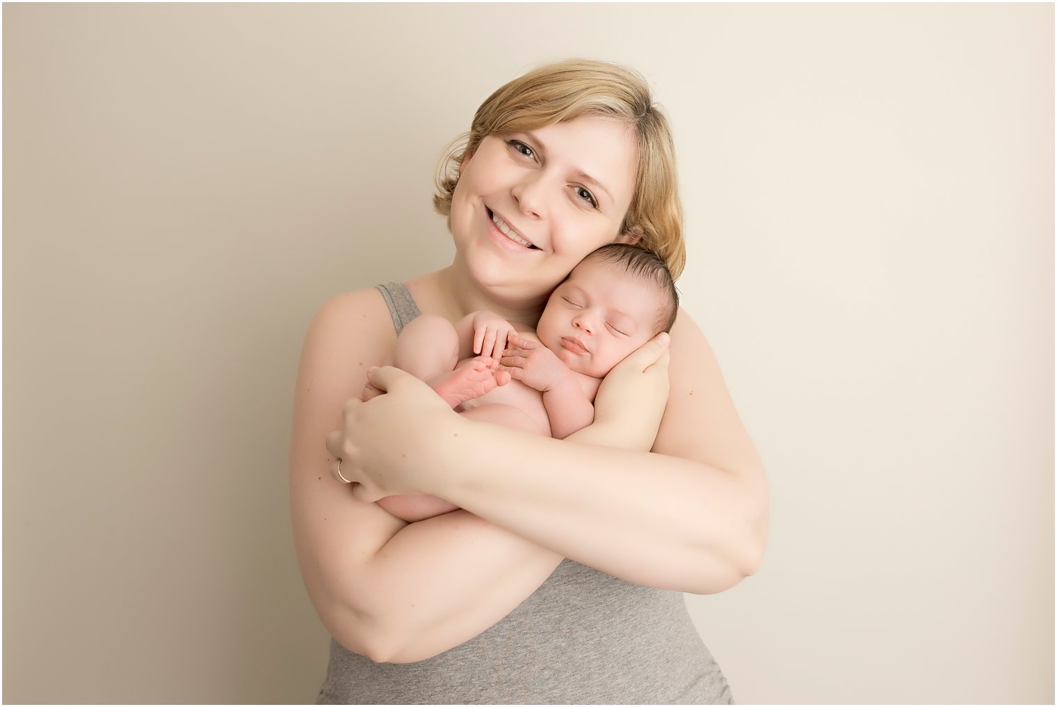 Mother and newborn girl photo by Idalia Photography