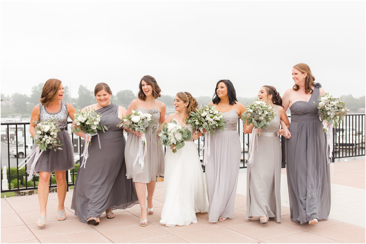 Candid bridesmaids walking photo