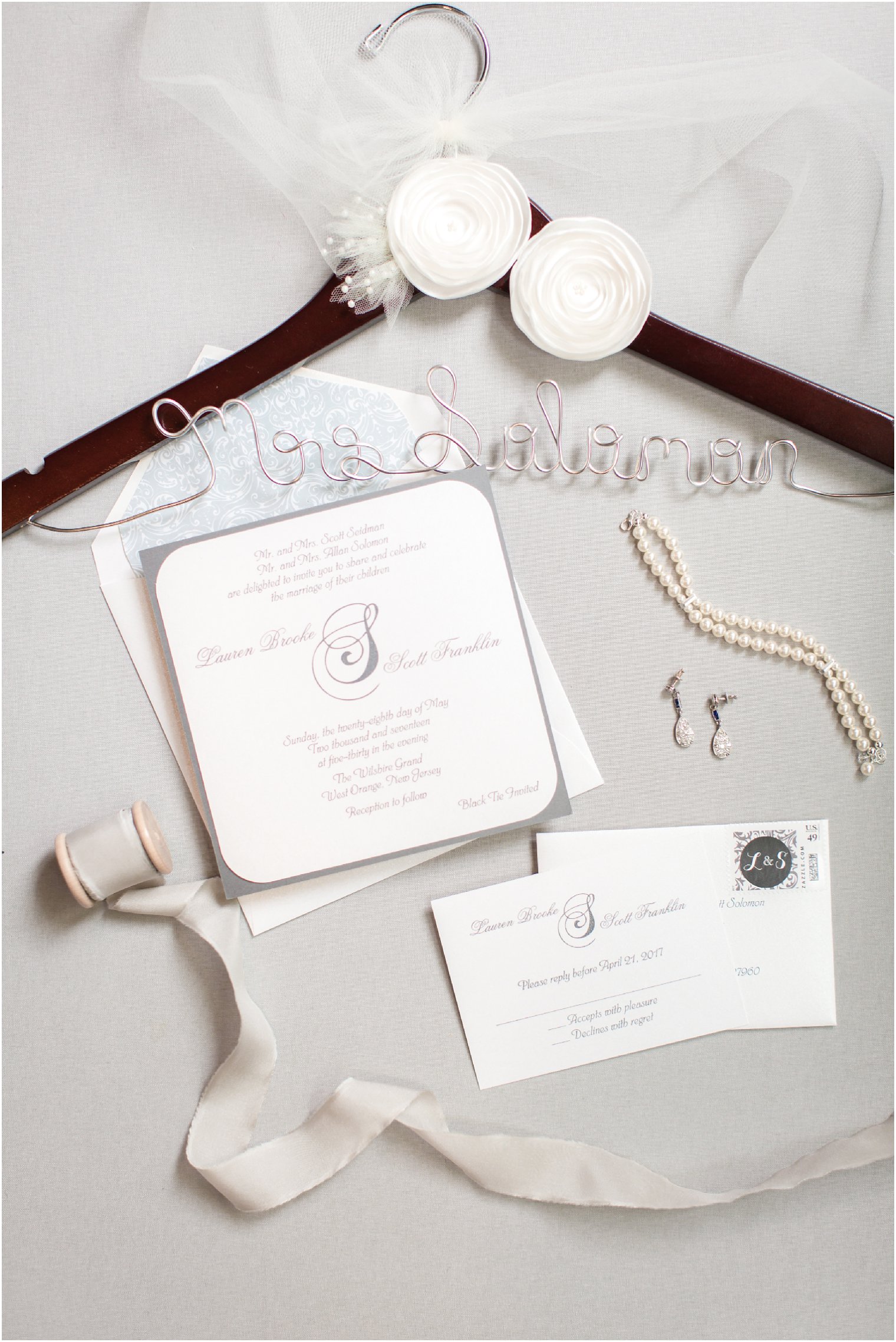 Custom hanger and wedding invitations | Photos by Idalia Photography