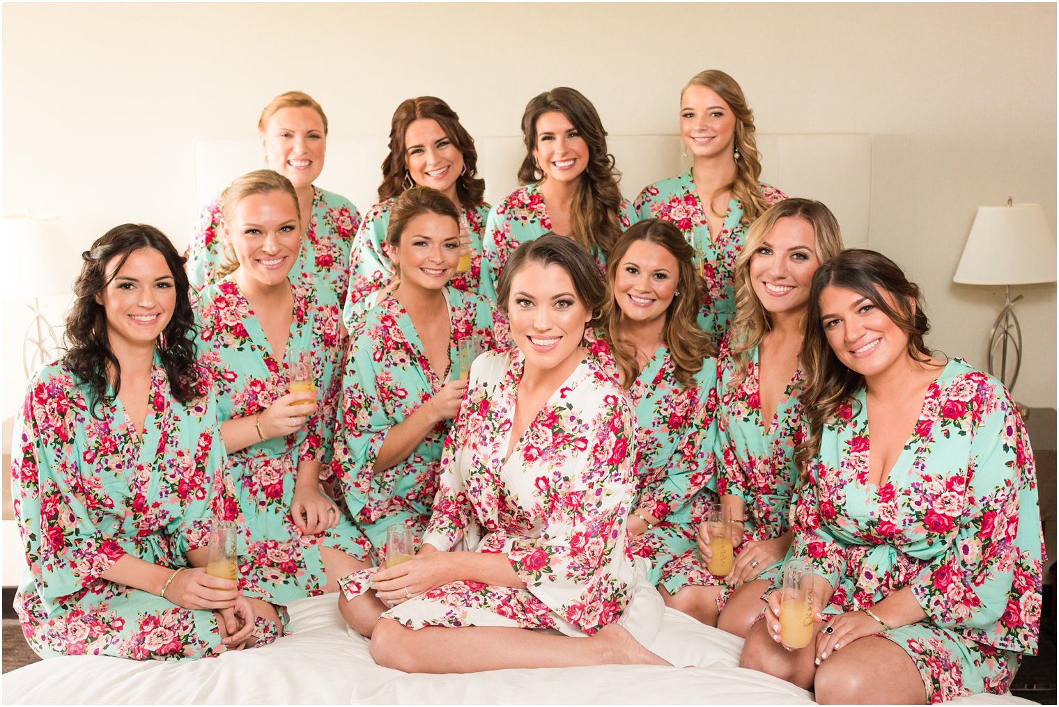 Bride and bridesmaids in floral robes at Windows on the Water at Frogbridge Wedding
