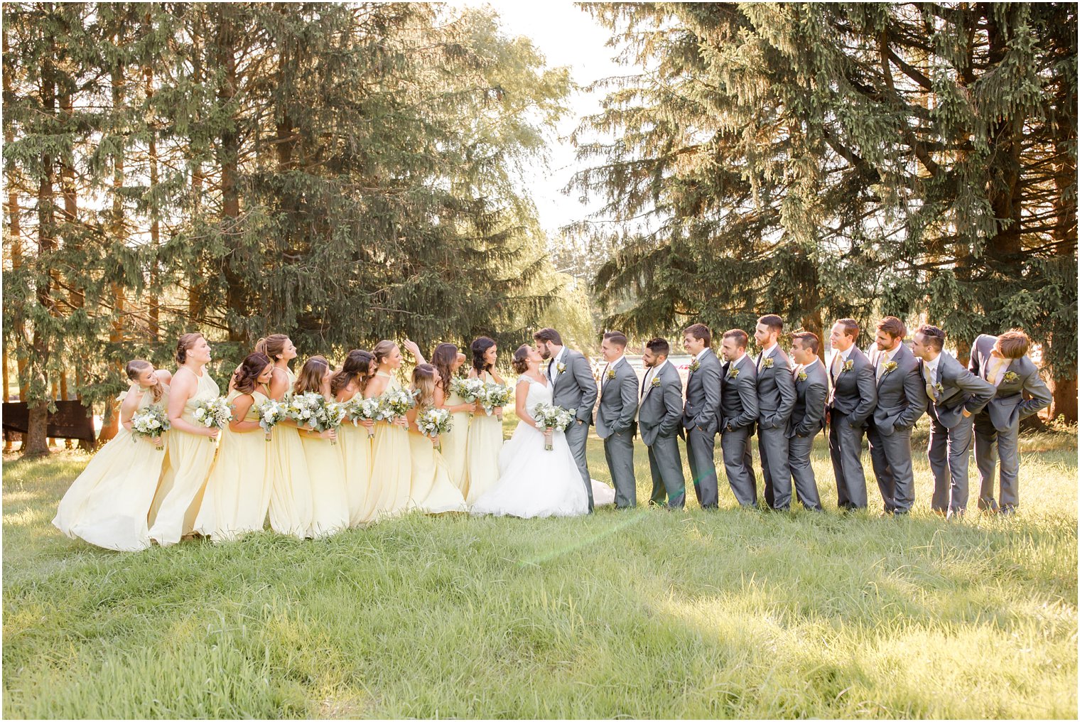 Large bridal party in yellow and gray at Windows on the Water at Frogbridge Wedding