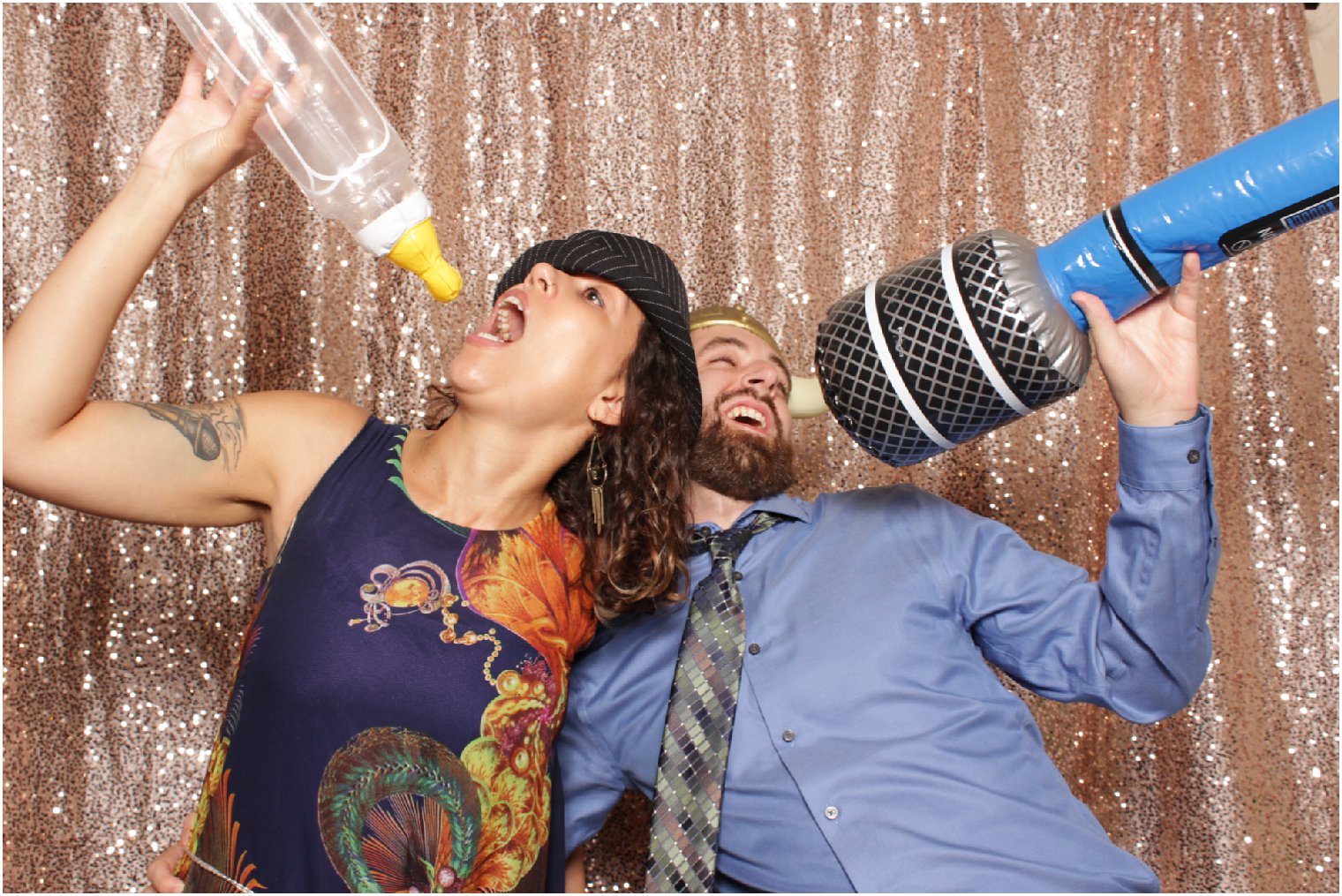 Couple having fun in the photo booth