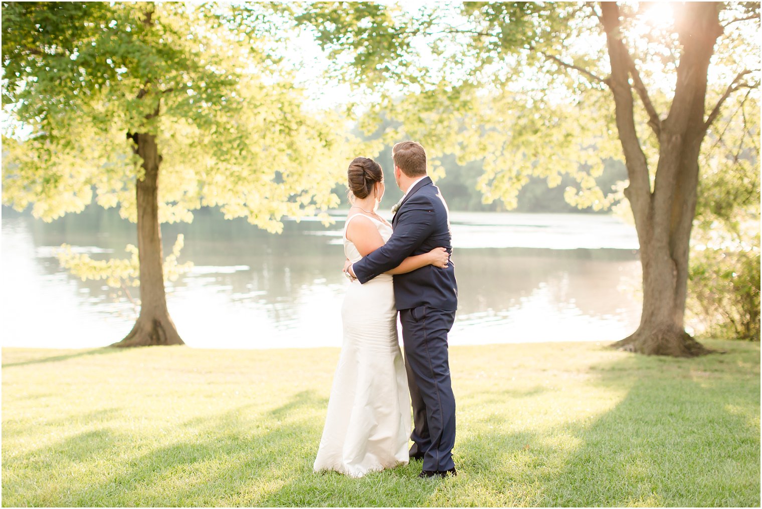 Bride and groom looking out to the lake