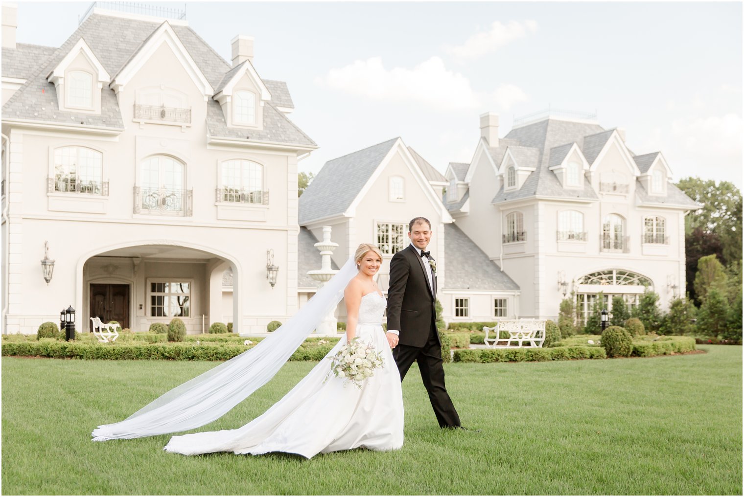 Bride and groom on grounds of Park Chateau Estate 