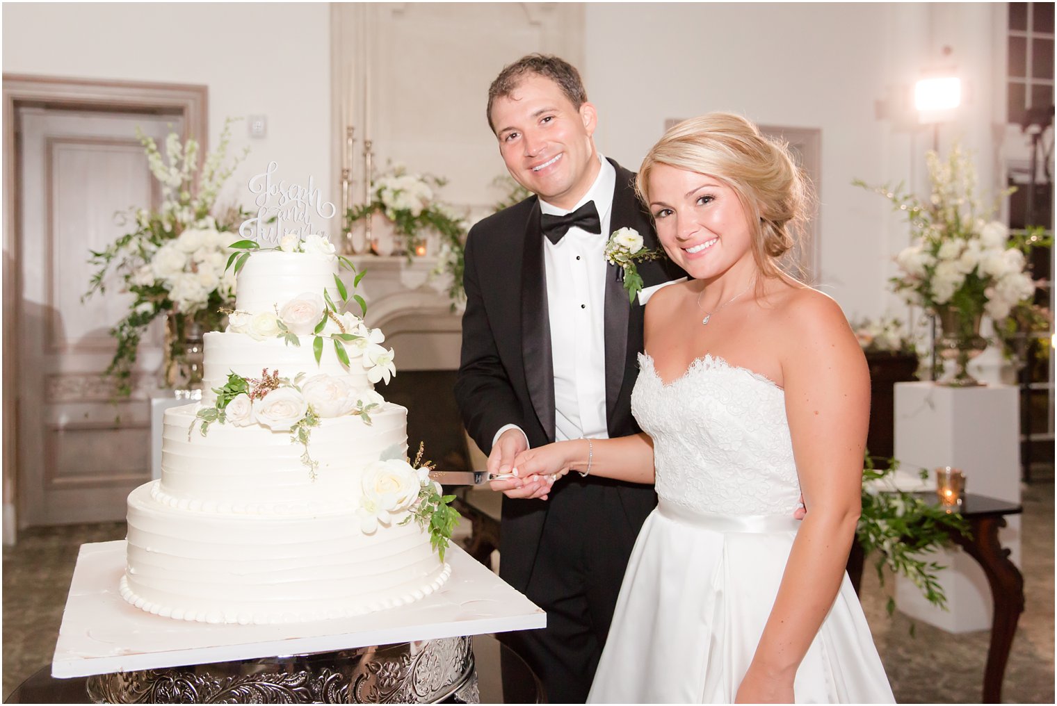 Bride and groom cutting reception cake at Park Chateau